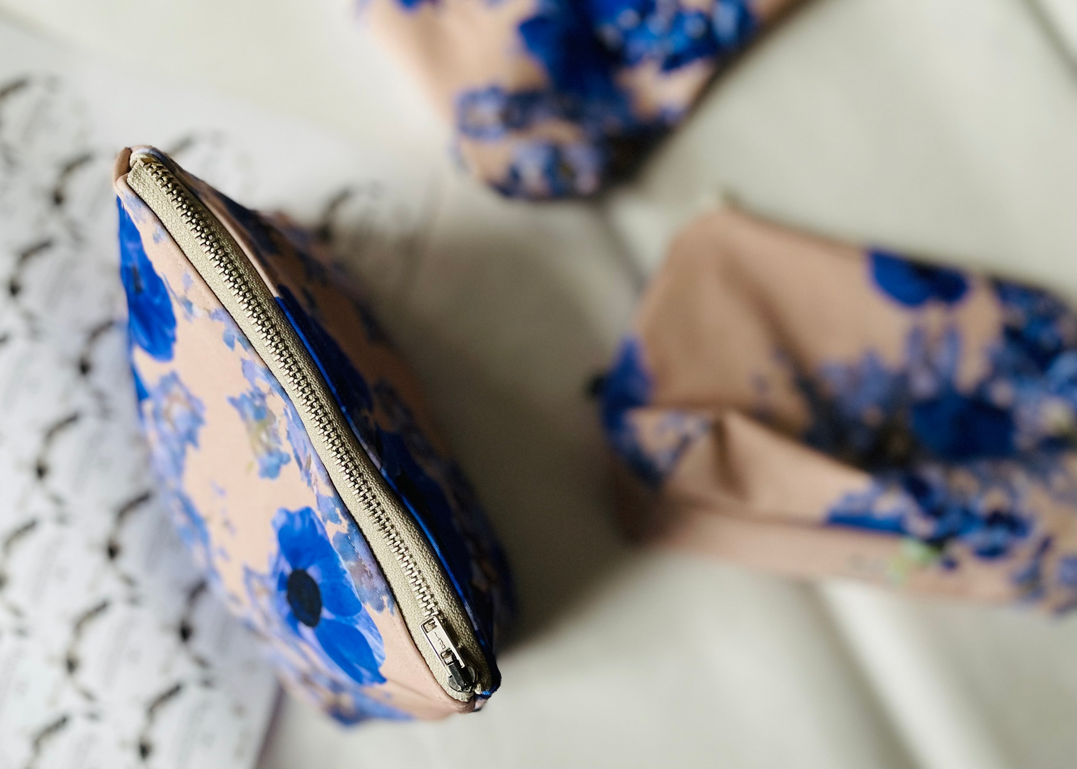 beige and blue floral makeup bag