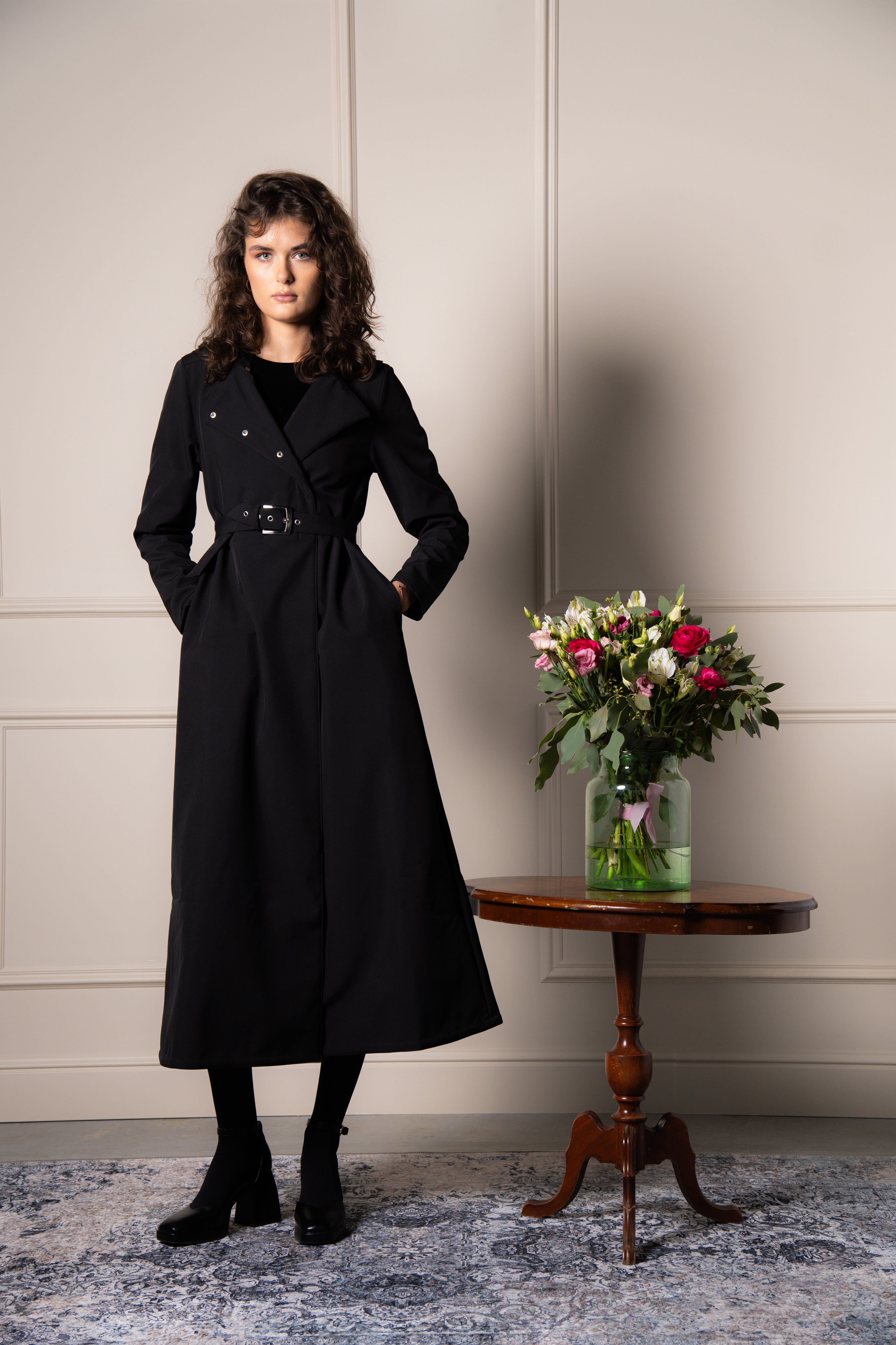 solid black waterproof coat in A-line cut