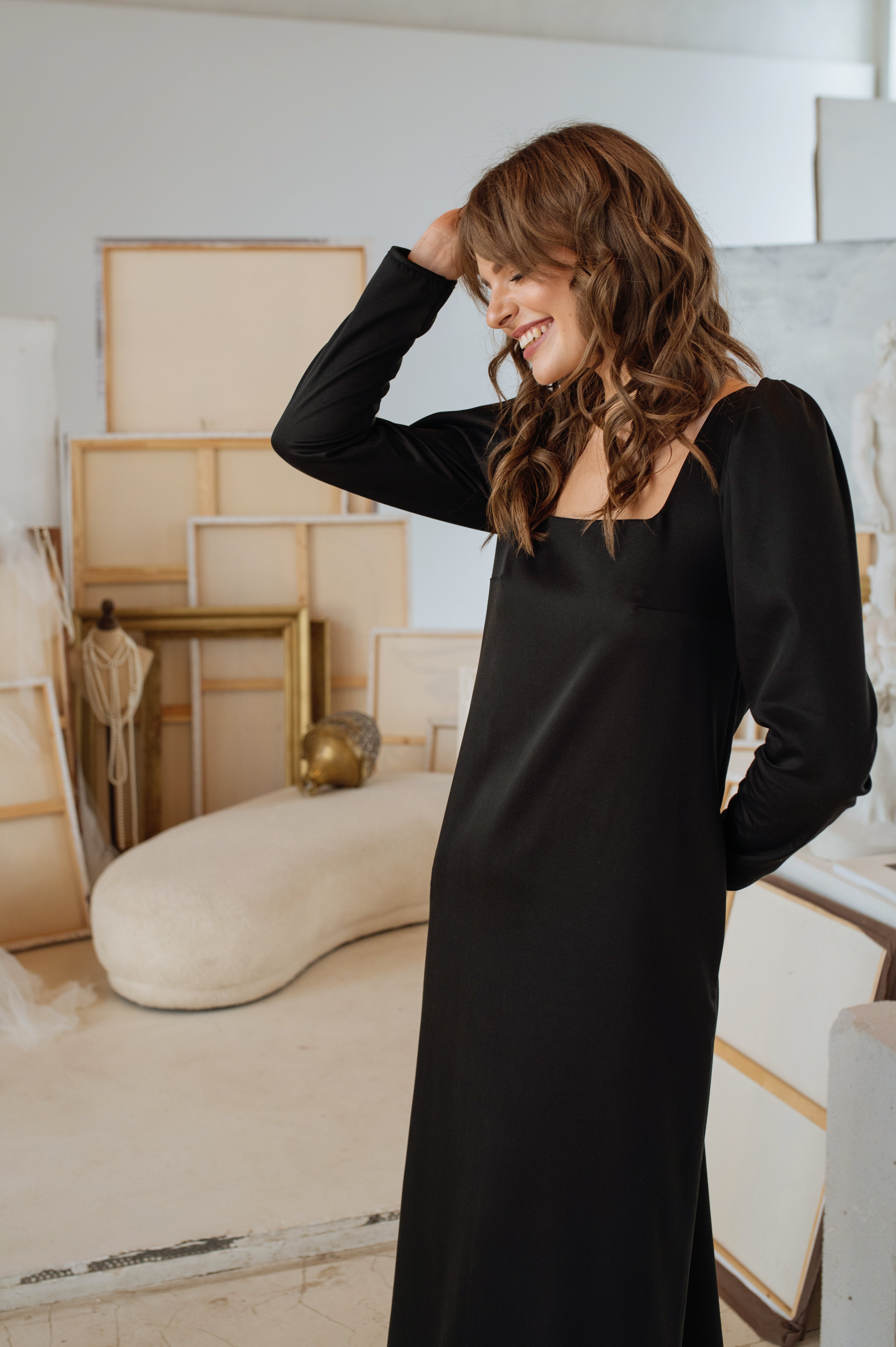 Model in the dress without the belt, highlighting the flowing, relaxed fit and soft drape of the fabric.