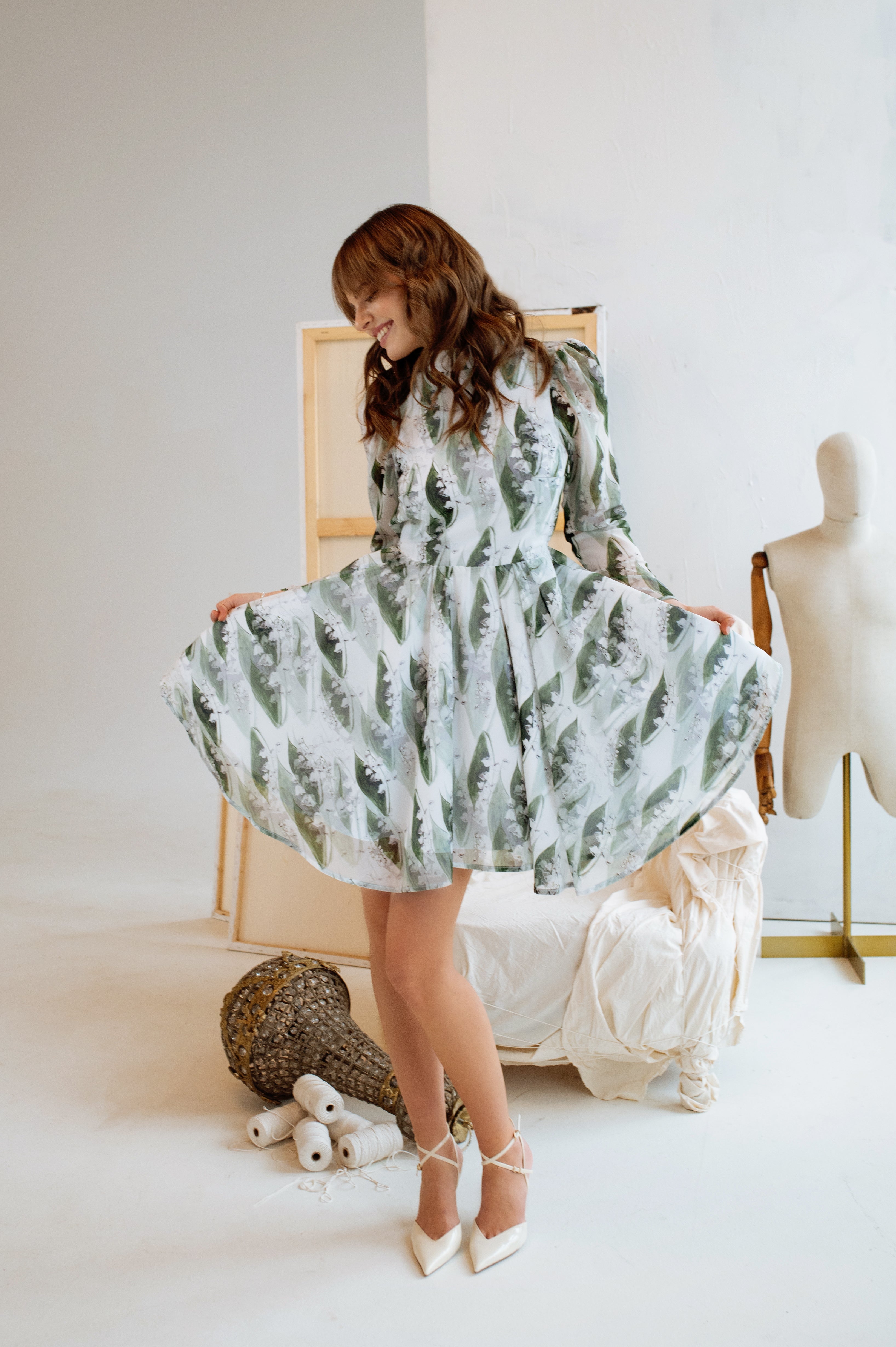 Full-body image of the model wearing the dress with heels, giving a complete view of the elegant and playful silhouette.