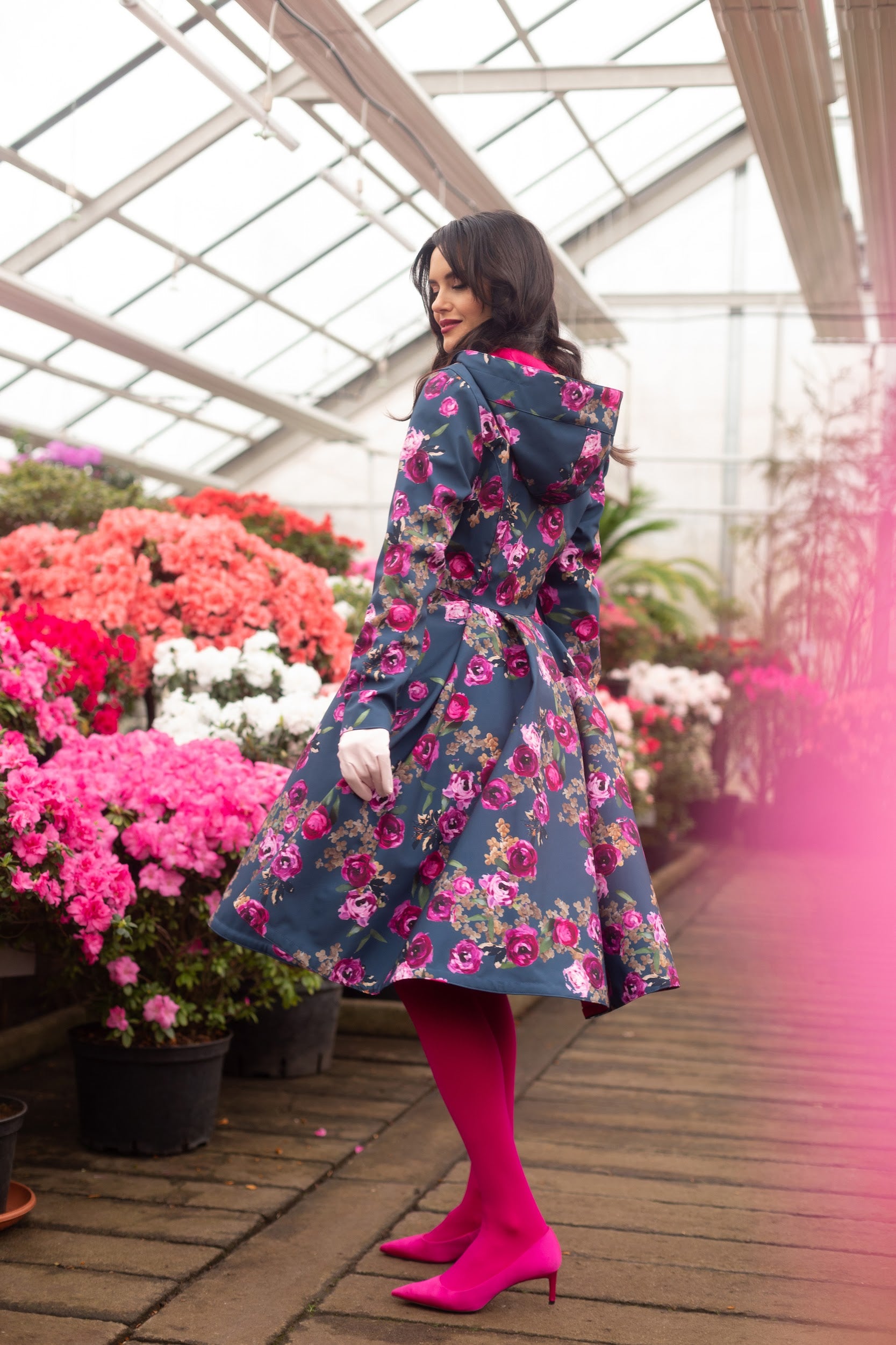 Side profile of pink Misty Rose coat by RainSisters – long sleeve and flattering waistline