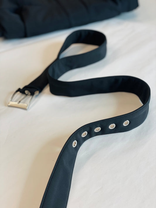 solid black belt featuring silver-tone hardware