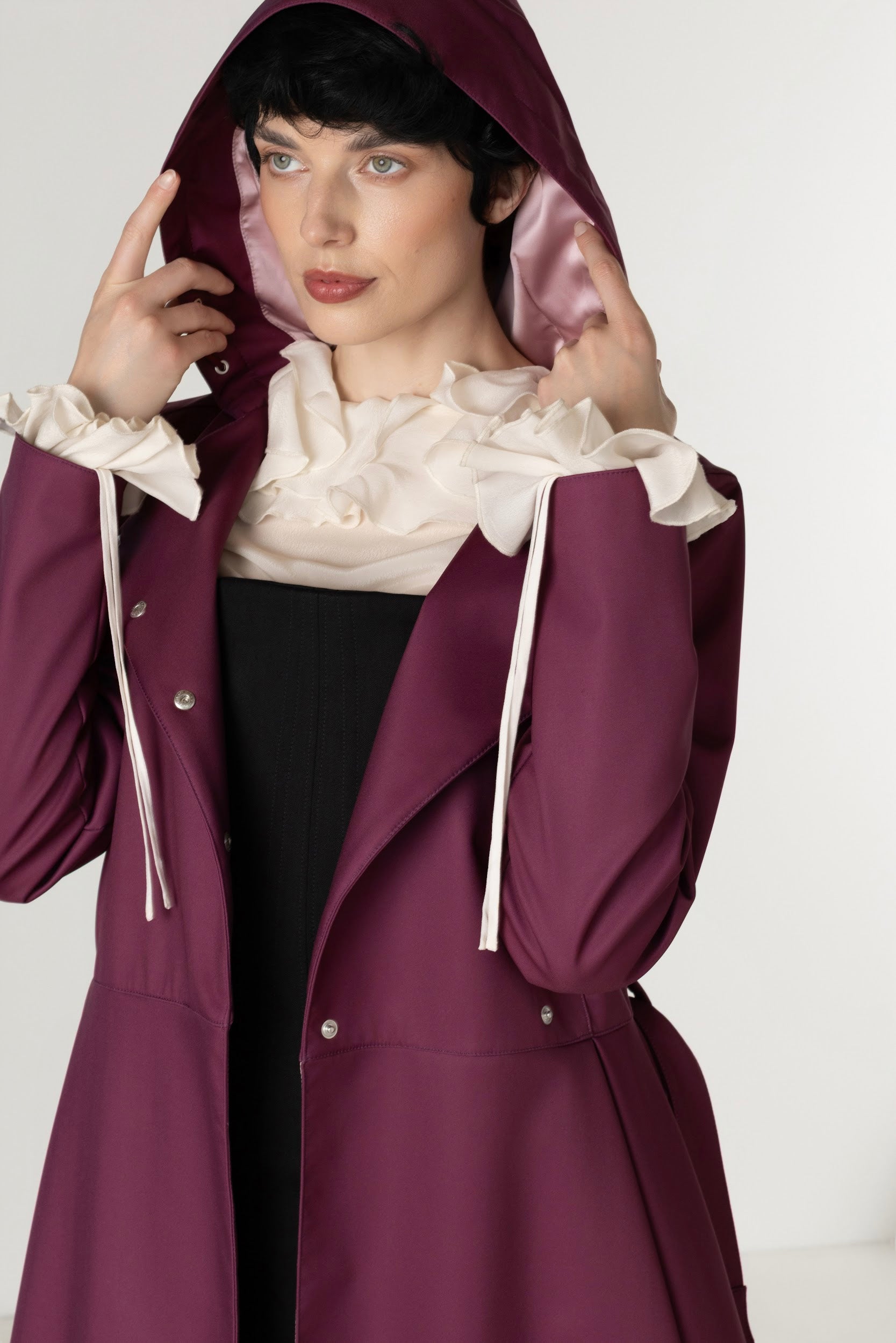 Women's deep burgundy double-breasted trench coat with a removable hood.