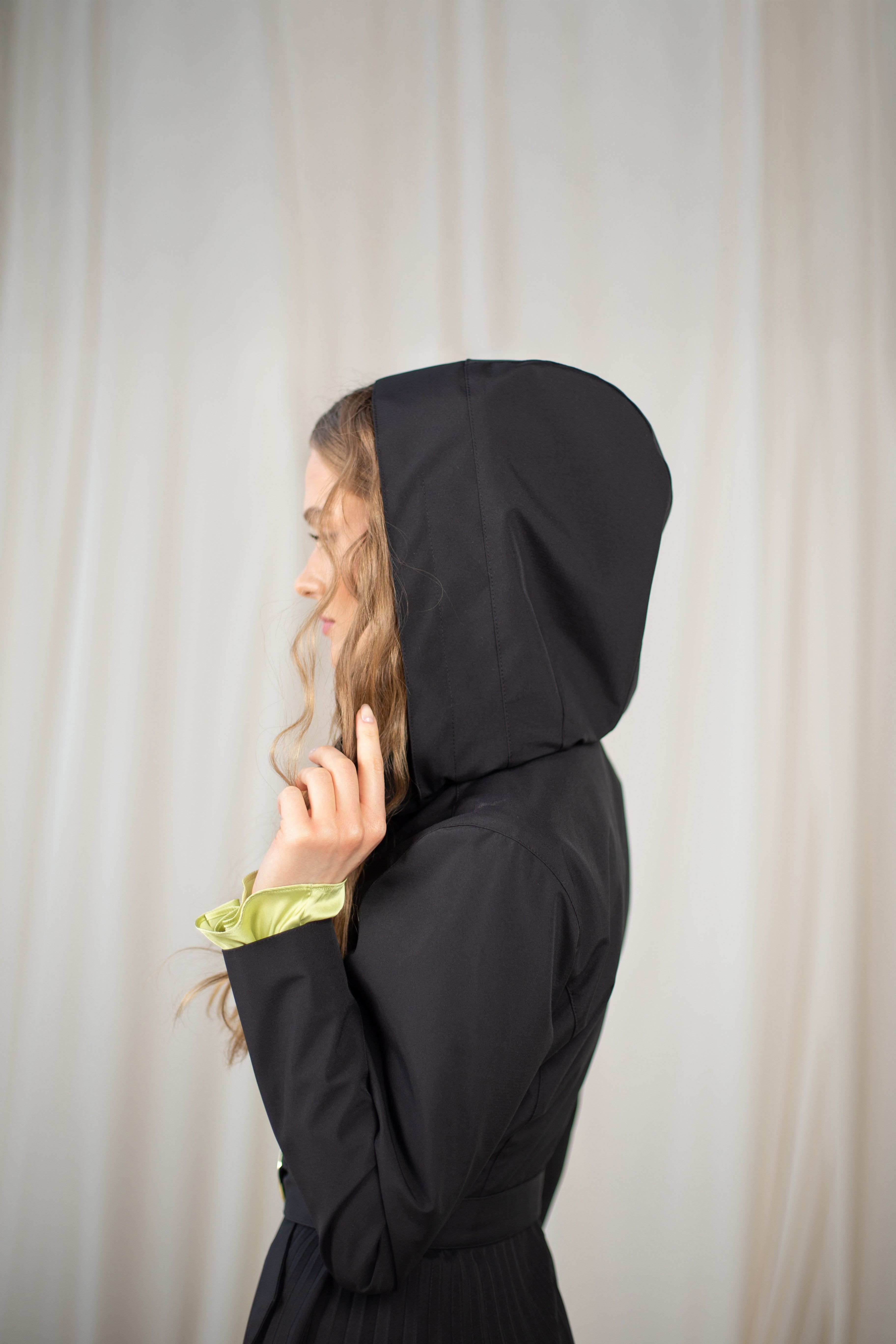 Black coat for spring with a detachable hood.