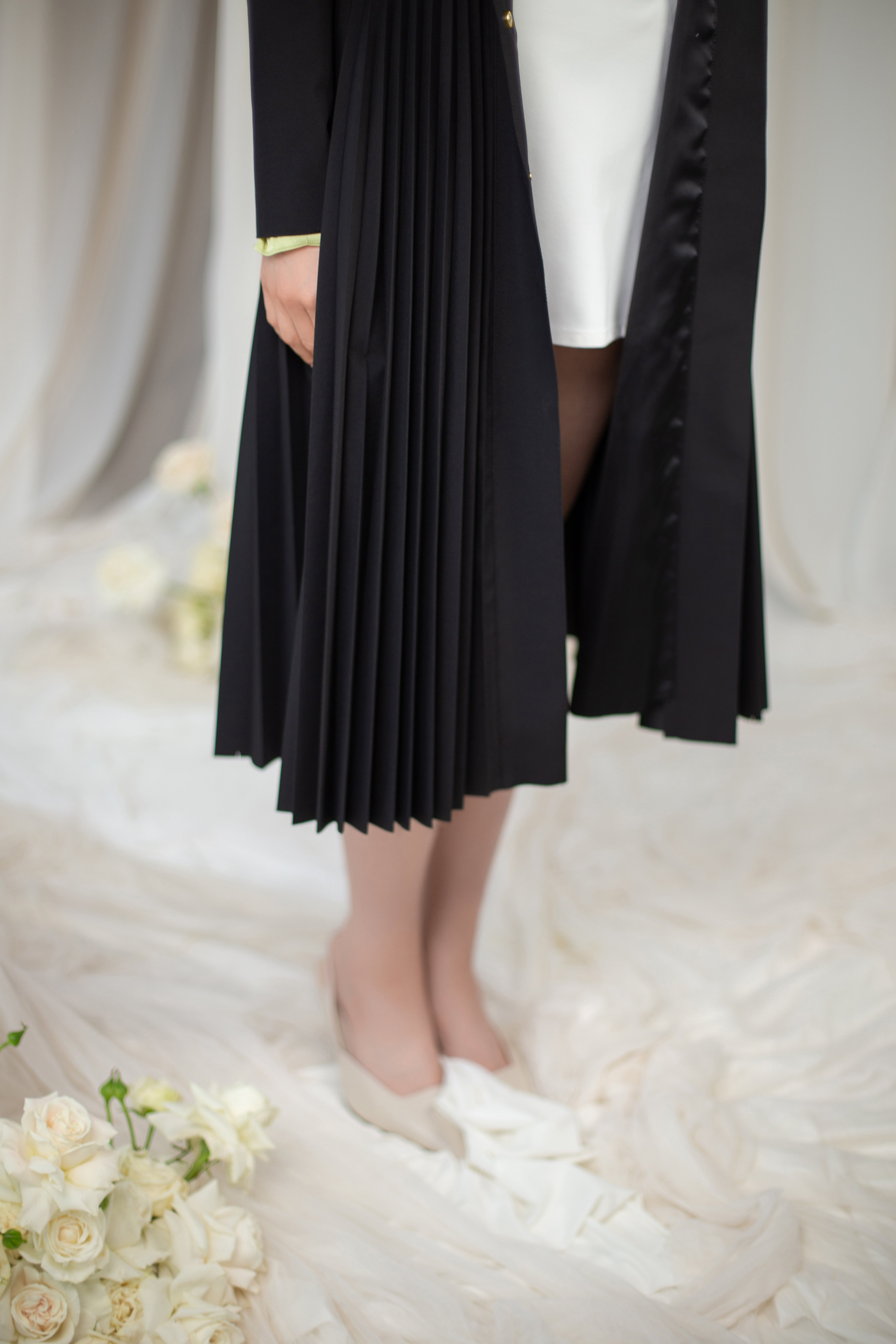 Black Sway coat with fully pleated skirt.