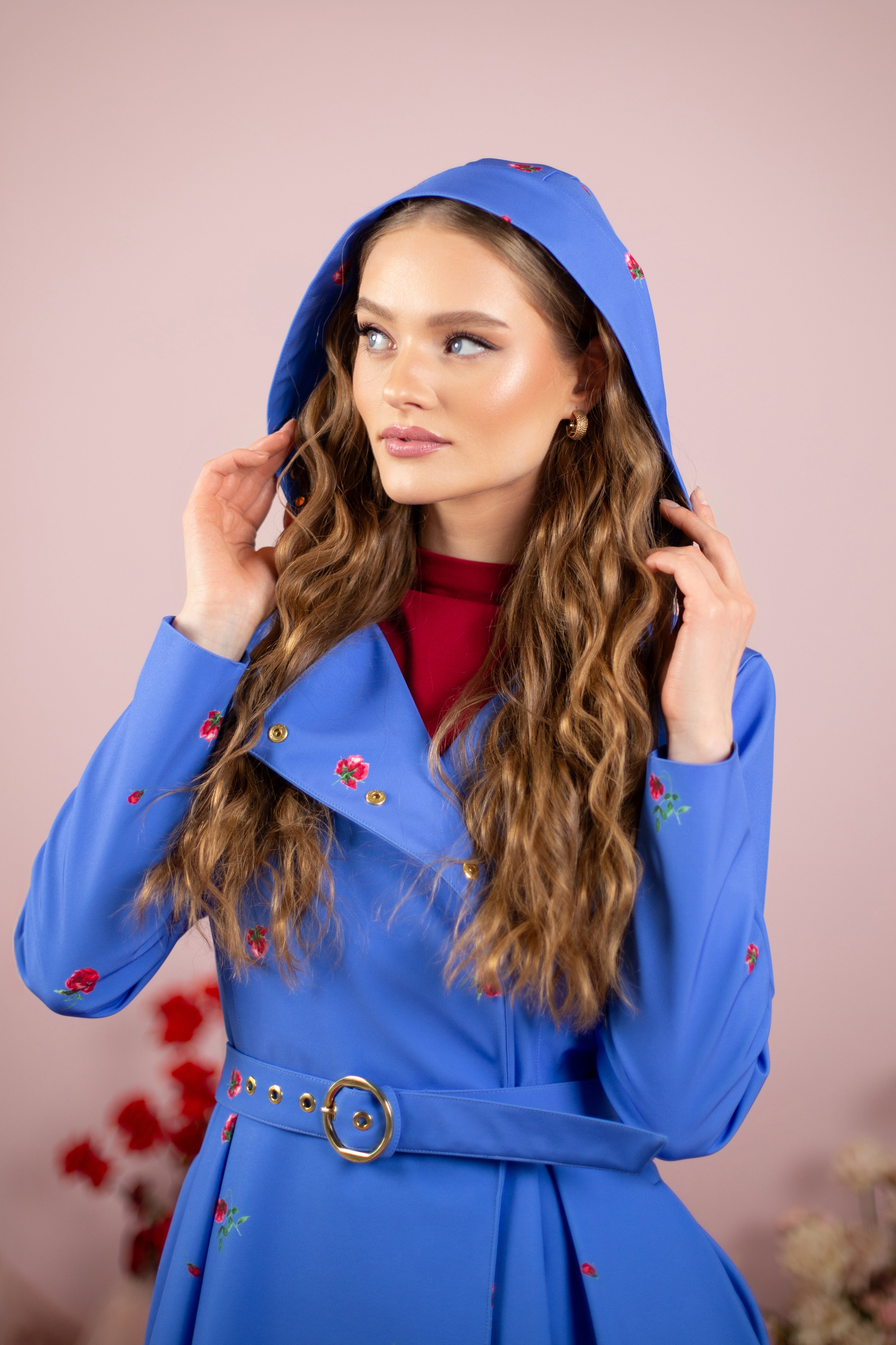 Blue trench coat with an adjustable hood.