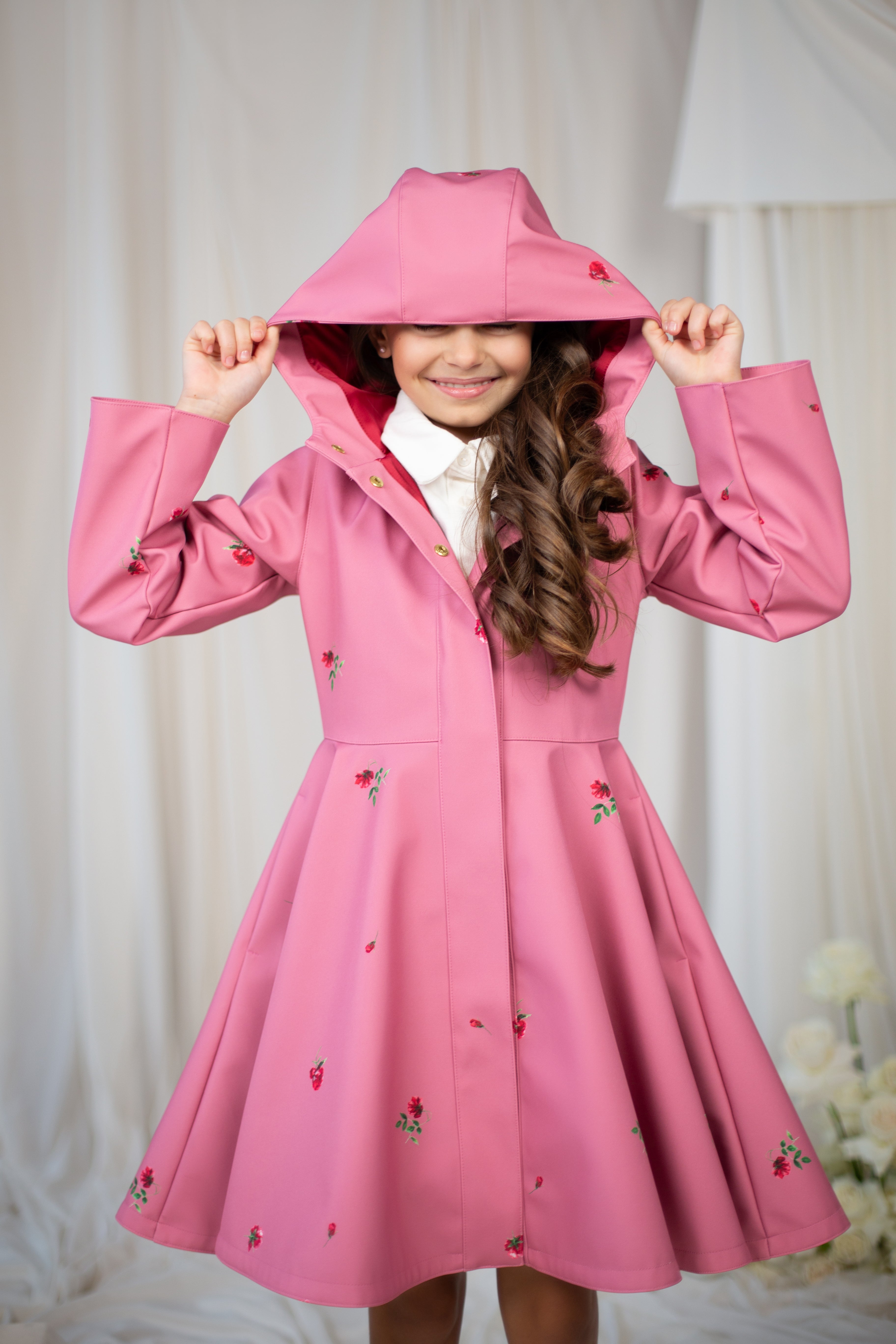 Adorable pink girls' coat with a classic cut and soft satin lining