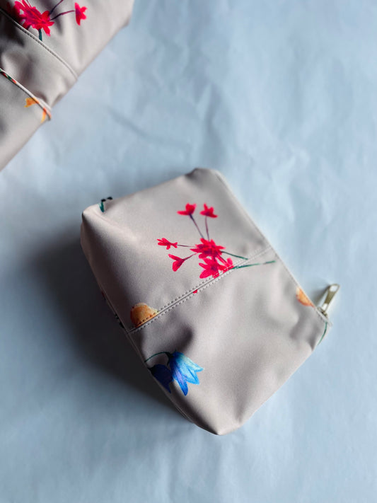 beige makeup bag with delicate flower print