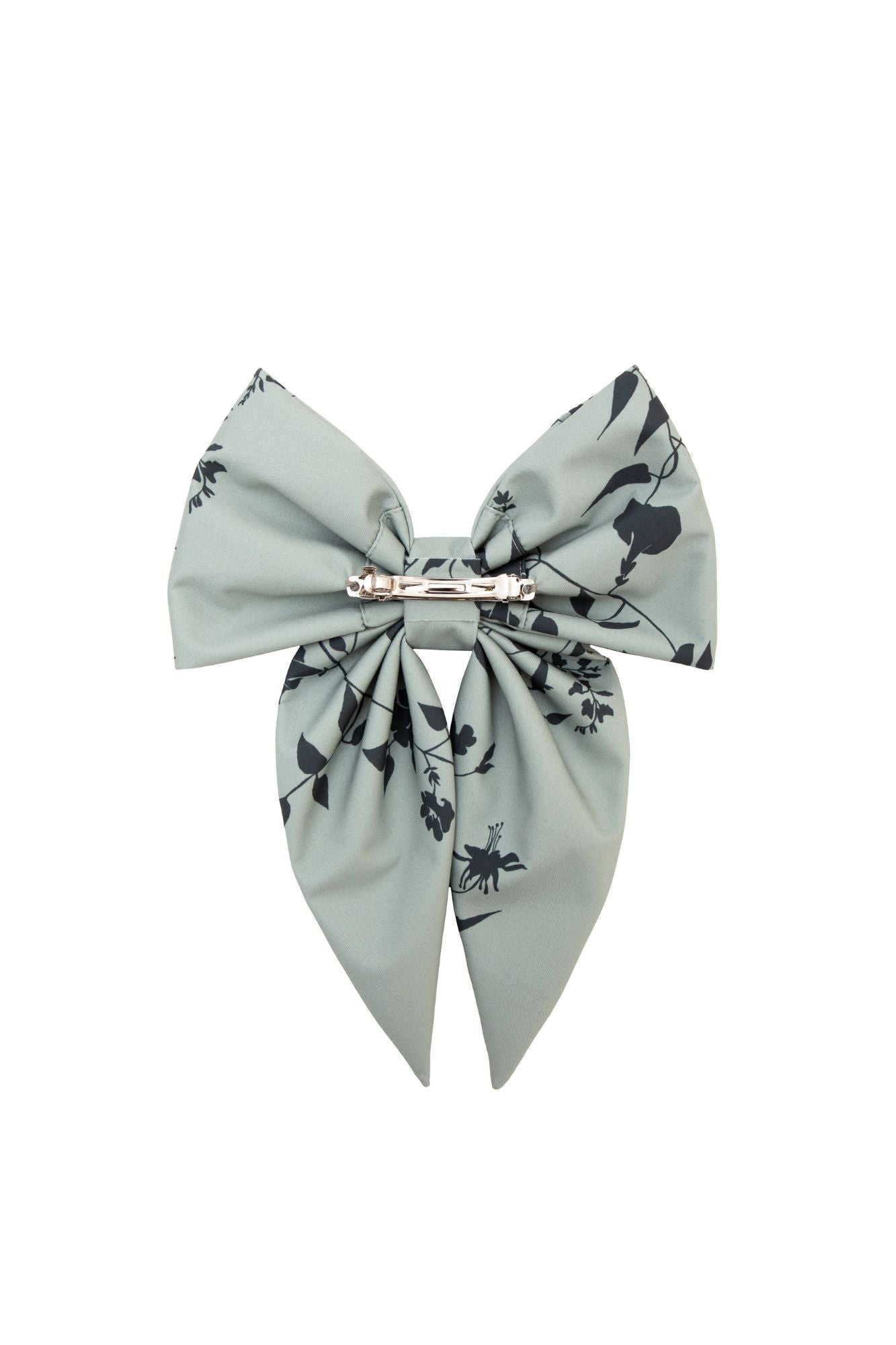 Large green bow with black floral pattern on a white background