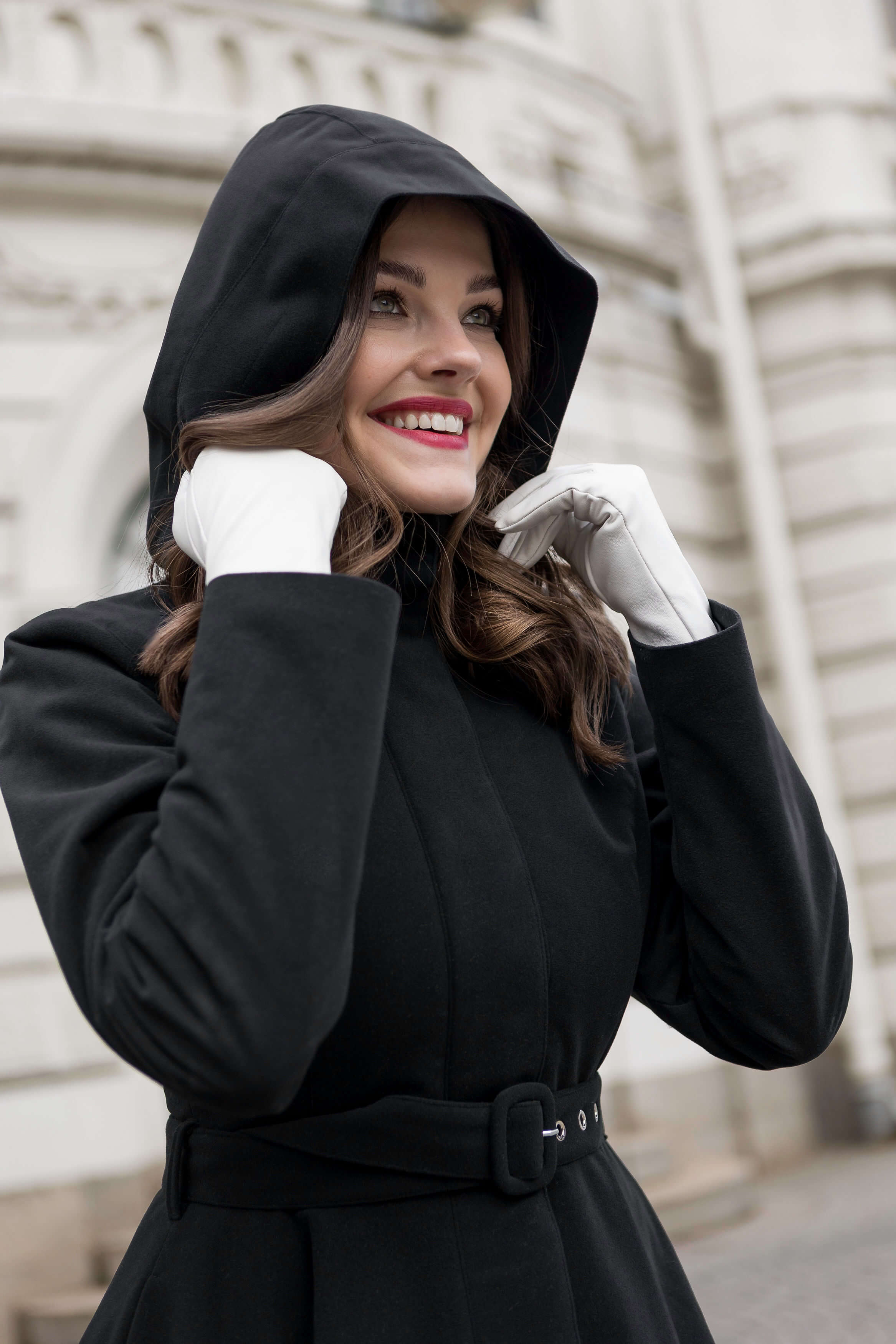 Obsidian Frost black coat in outdoor setting, combining style, warmth, and sustainability.