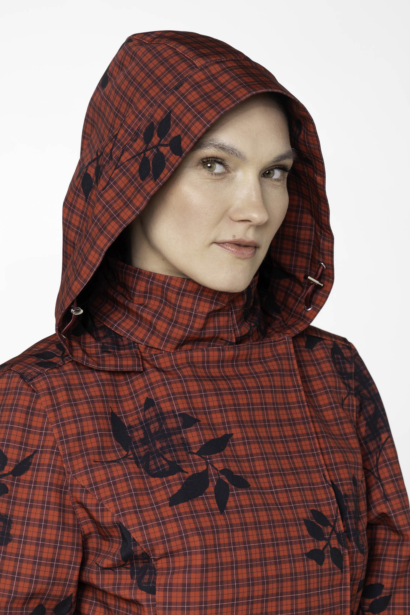 Close-up of detachable hood on deep red waterproof women's rain jacket by RainSisters