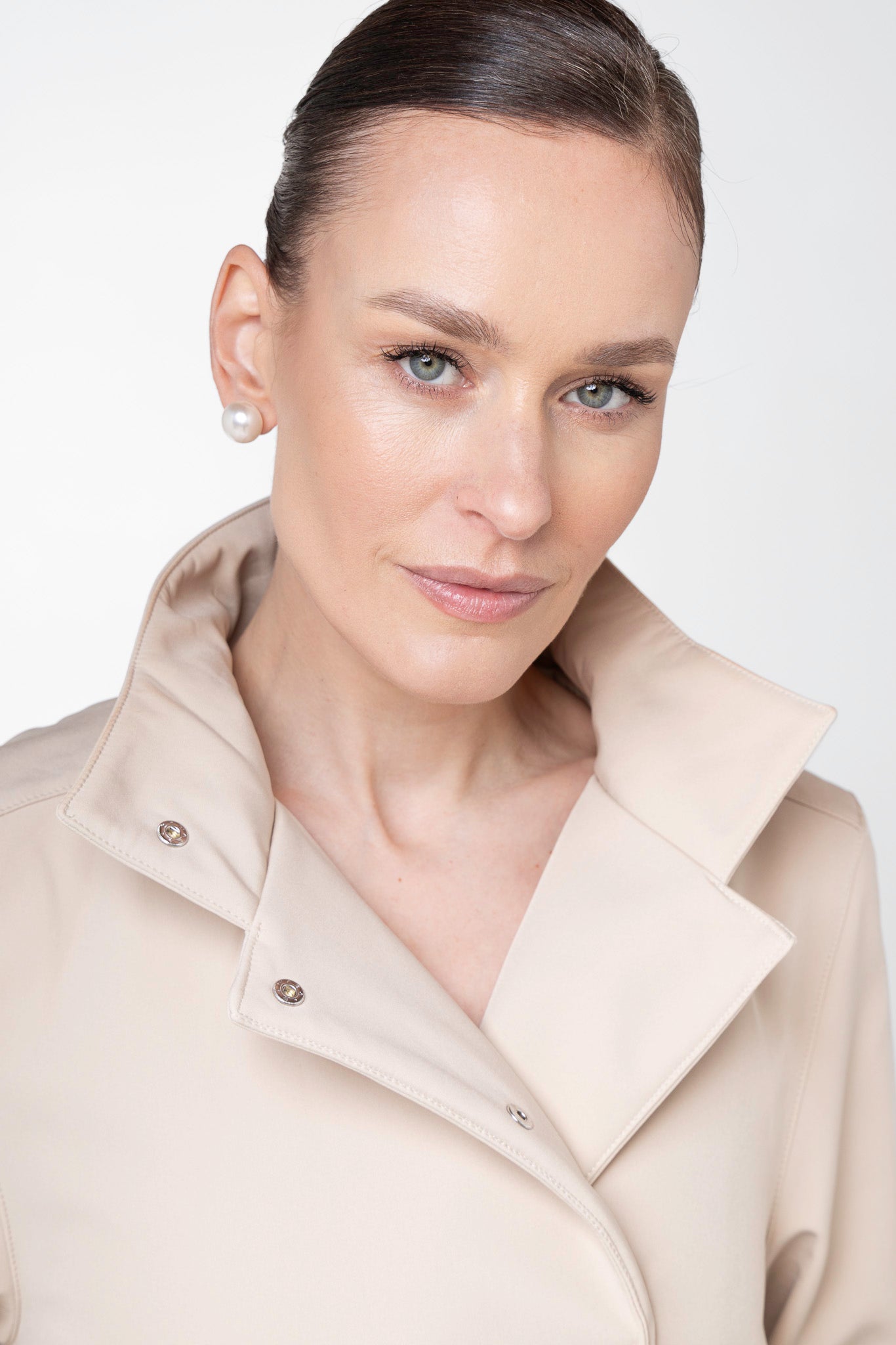 Detachable hood detail on Desirable Bow beige women's trench coat