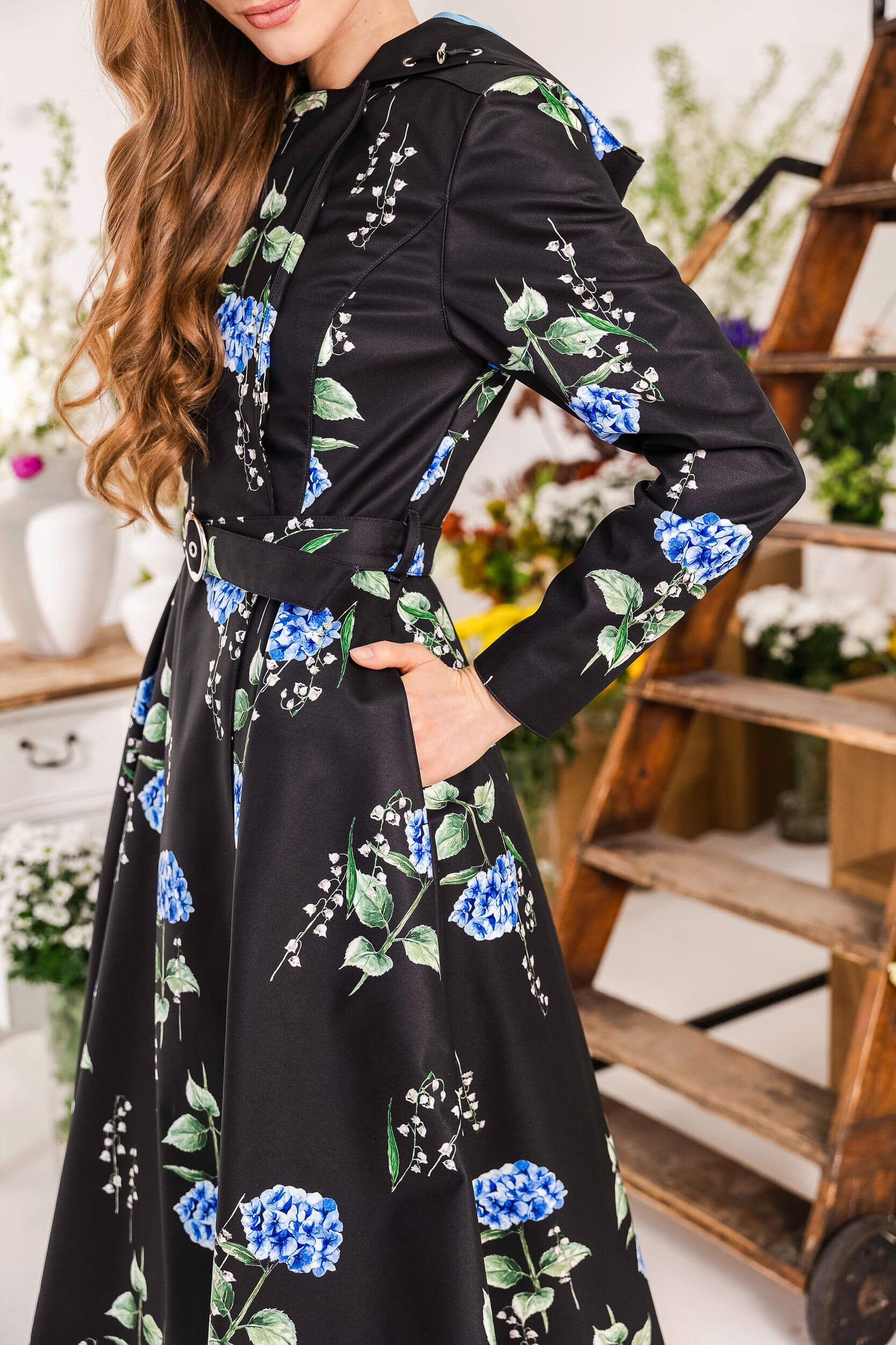 Women’s waterproof black coat with blue floral print and adjustable hood