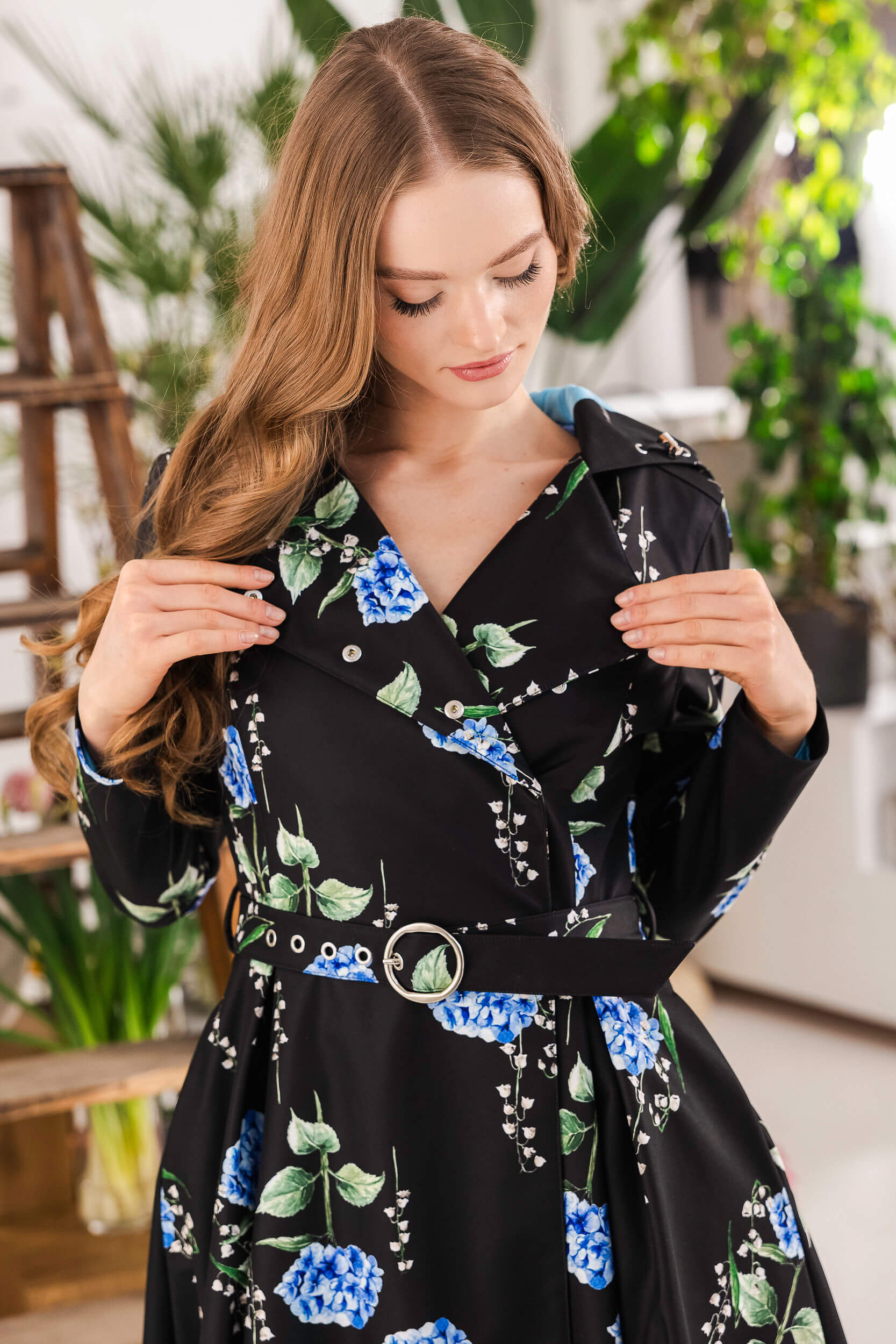 Close-up of lily of the valley print on black coat