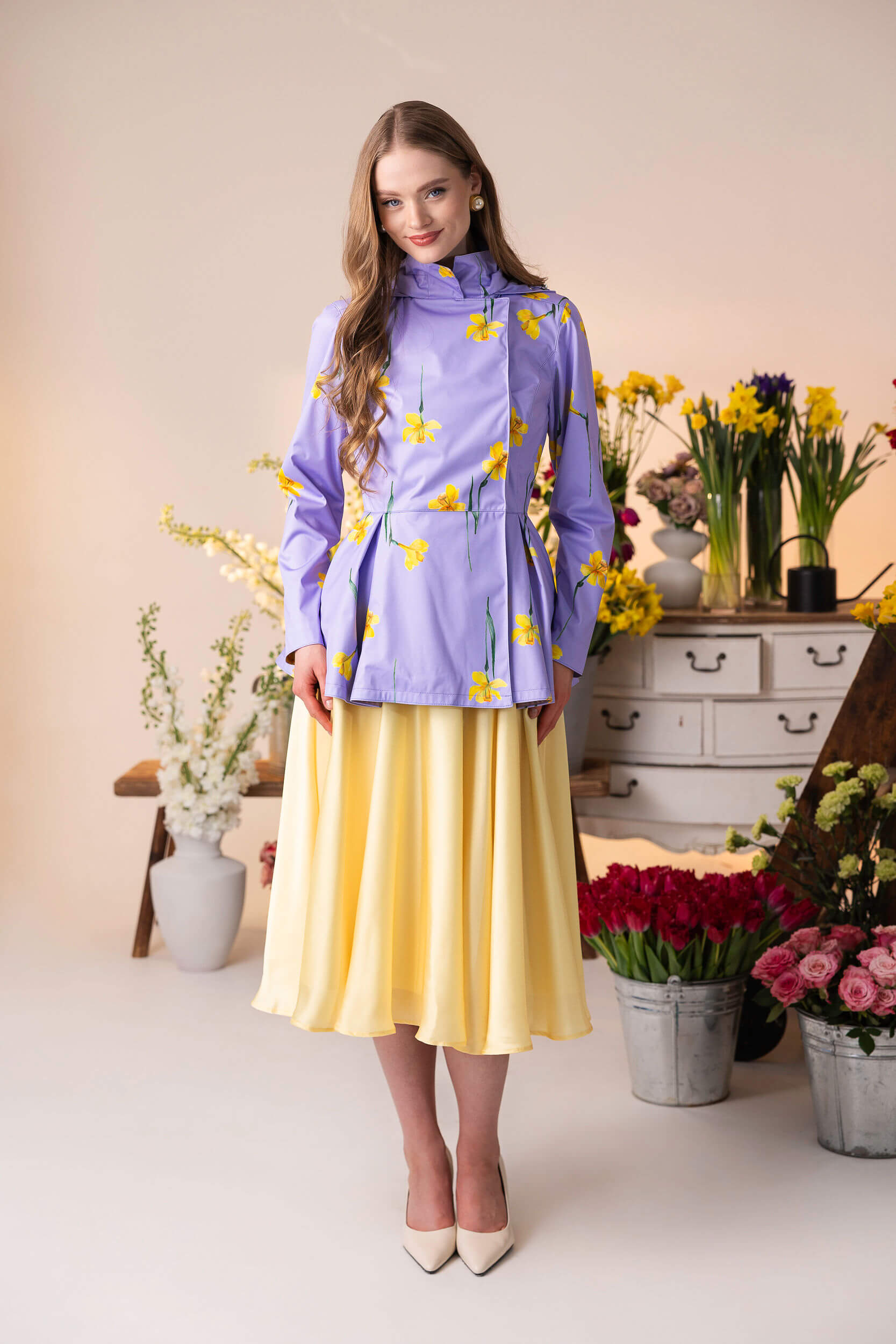 Lilac Joy feminine violet coat layered over a dress.