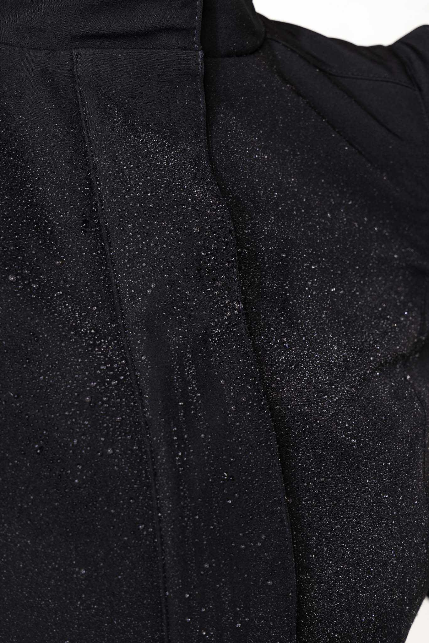 Close-up of a black textured waterproof fabric without a hood