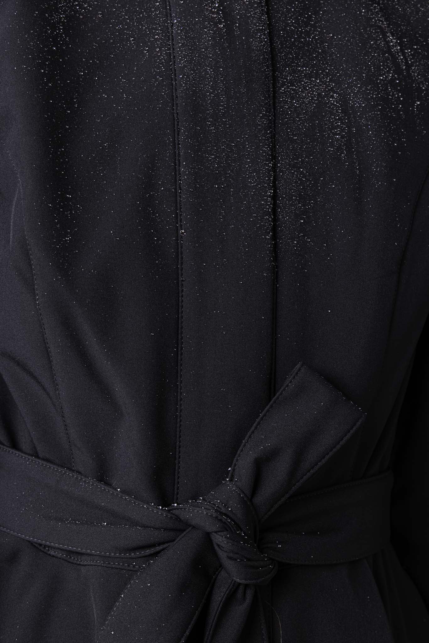 Close-up of waterproof membrane outerwear fabric on elegant women's fit and flare coat