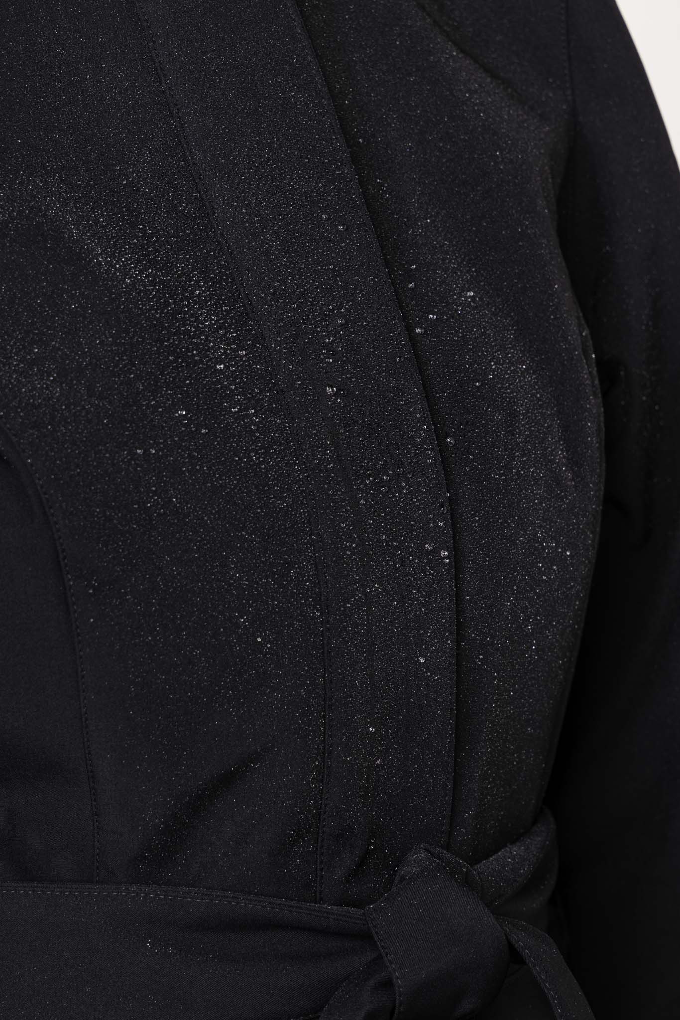 Black tailored outerwear waterproof fabric with striking red lining detail on women's coat