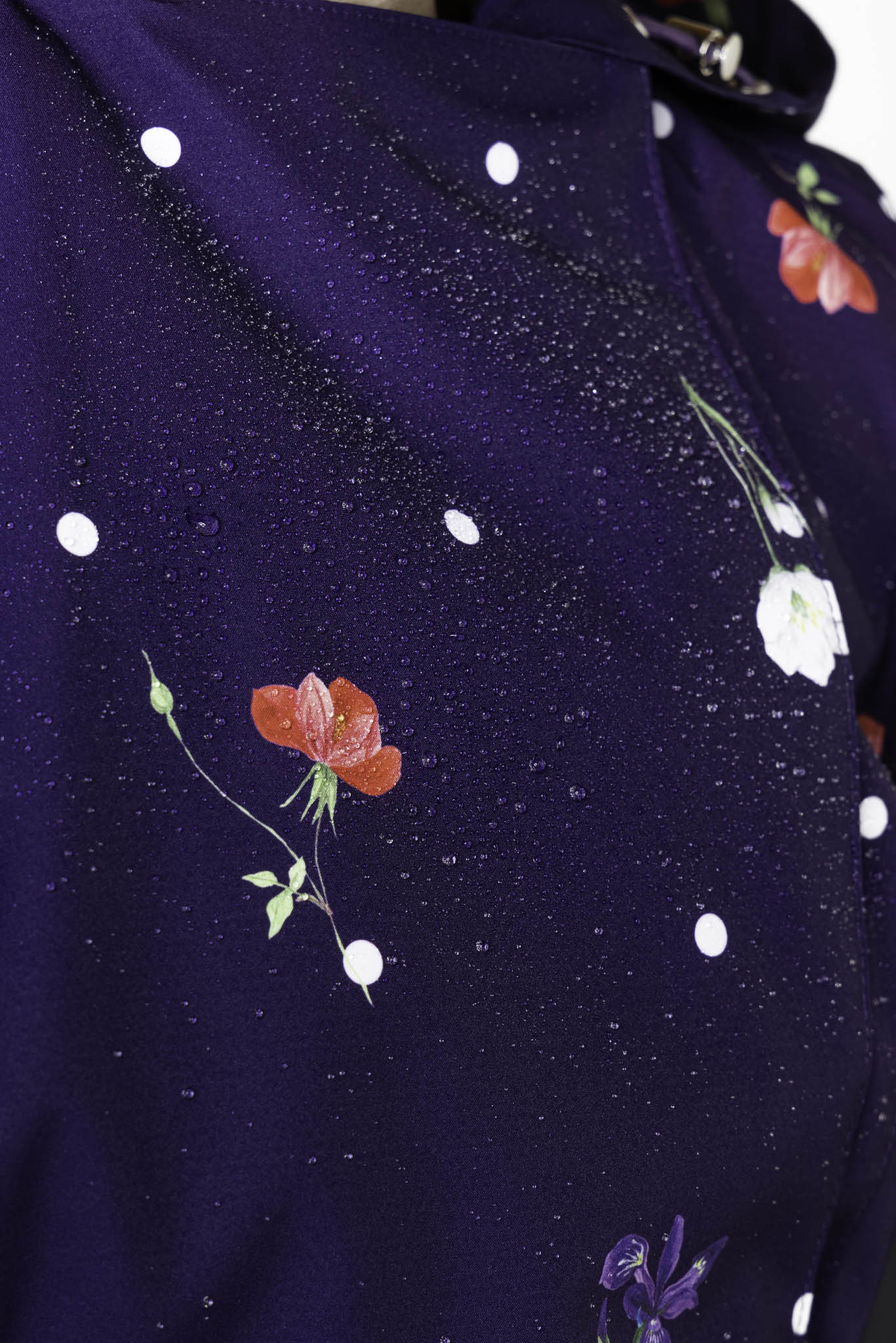 Lightweight water-resistant membrane fabric detail on violet spring trench coat