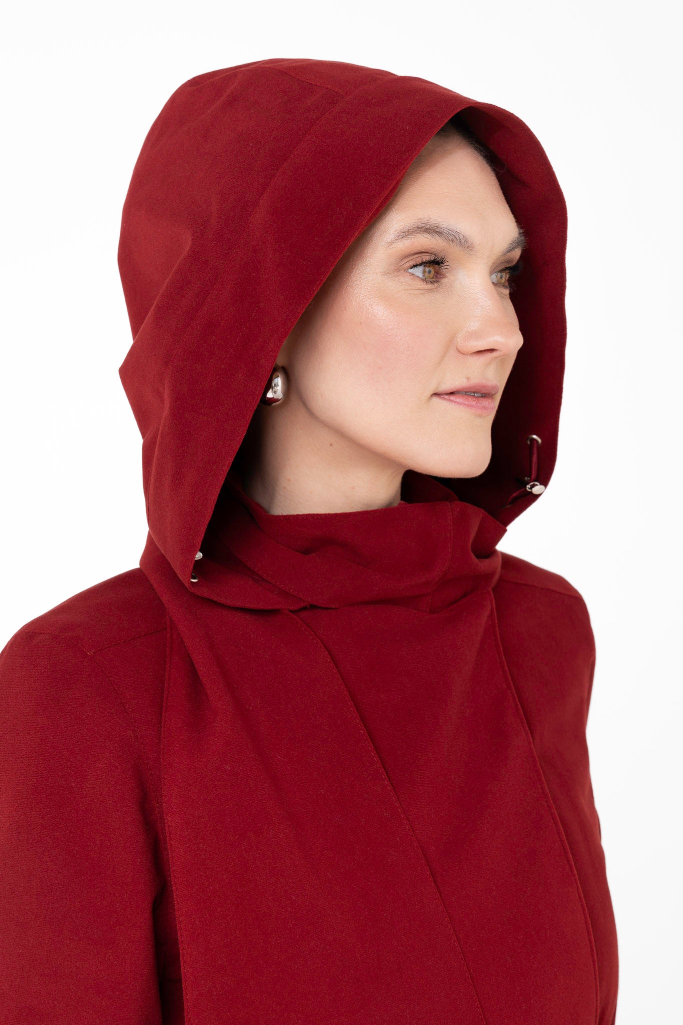 Close-up of hood detail on maroon double-breasted women's winter coat