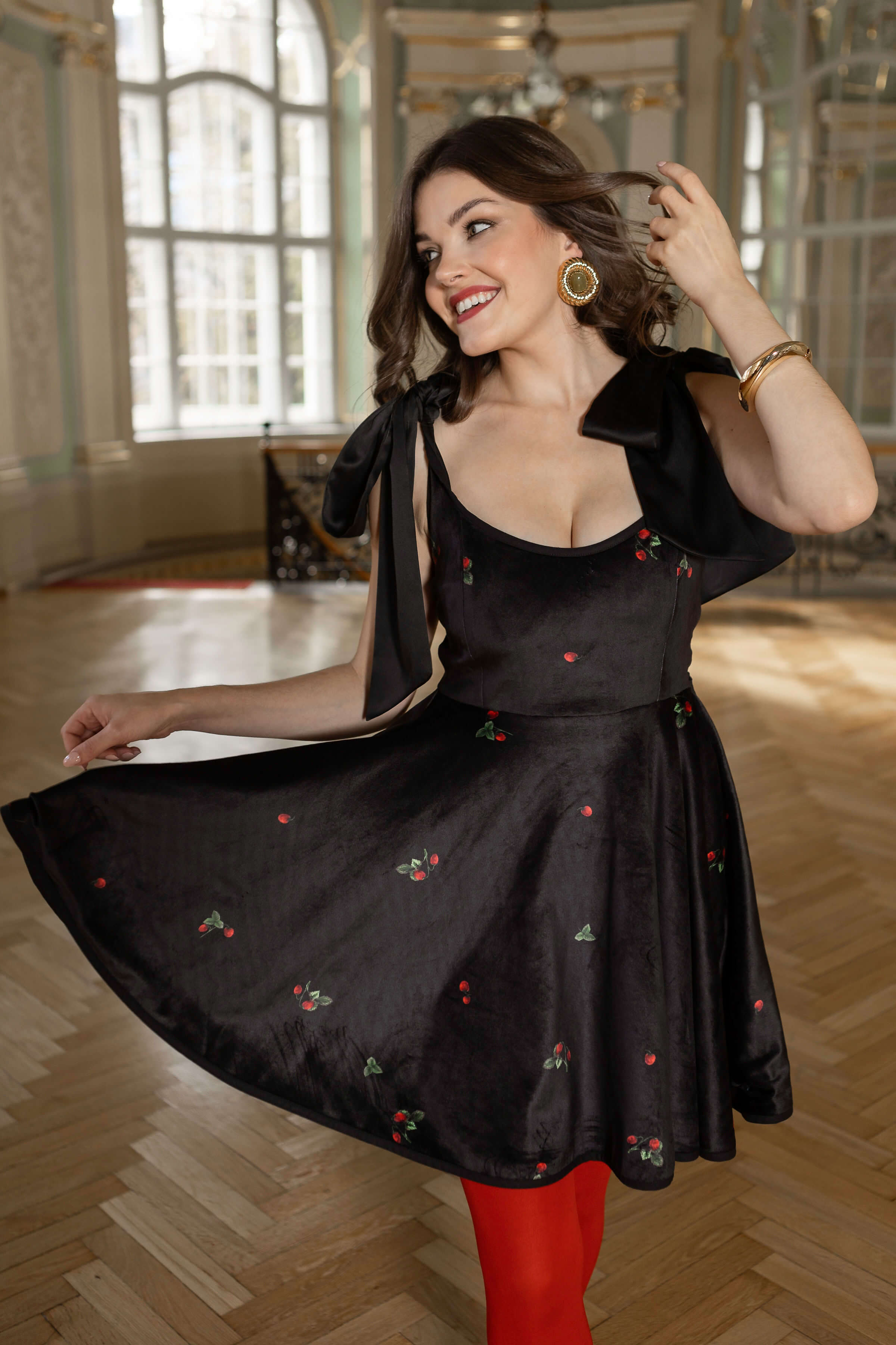 Romantic black velvet dress featuring shoulder bows, twirl skirt, and hidden zip.