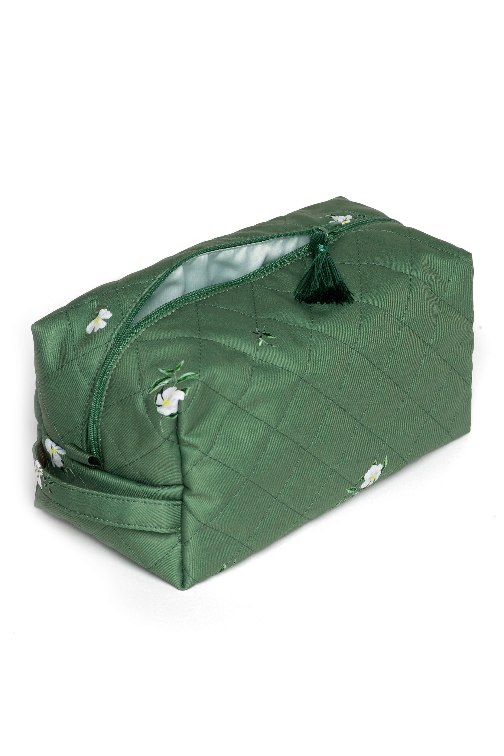 Large green makeup bag featuring a delicate white floral print and fresh mint lining.