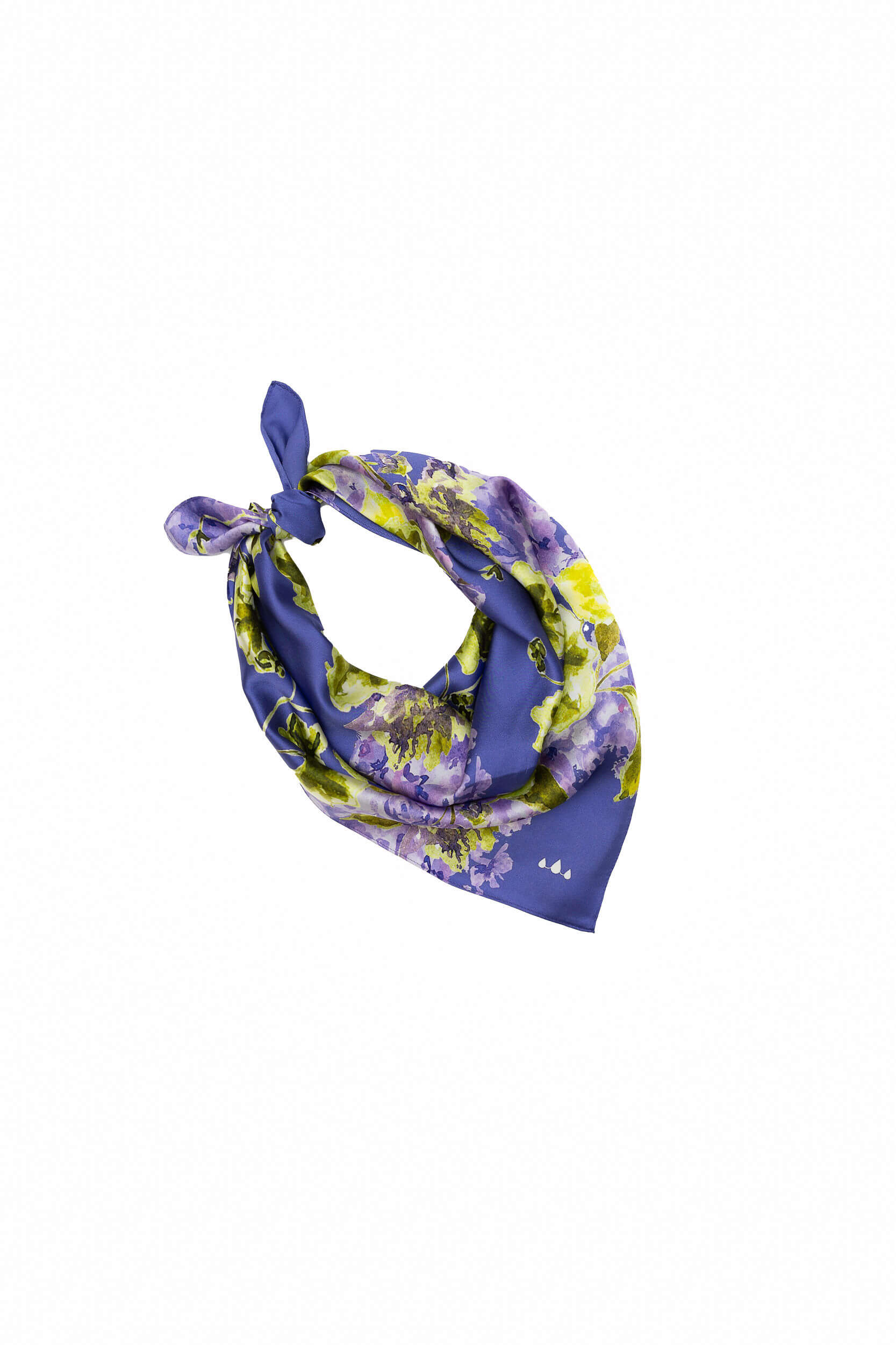 Floral patterned scarf tied in a knot on a white background