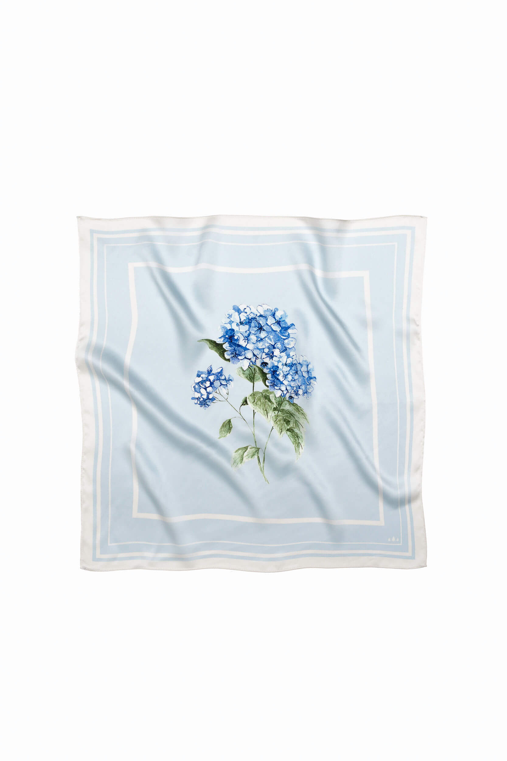 Light blue natural silk scarf with flower print on it.