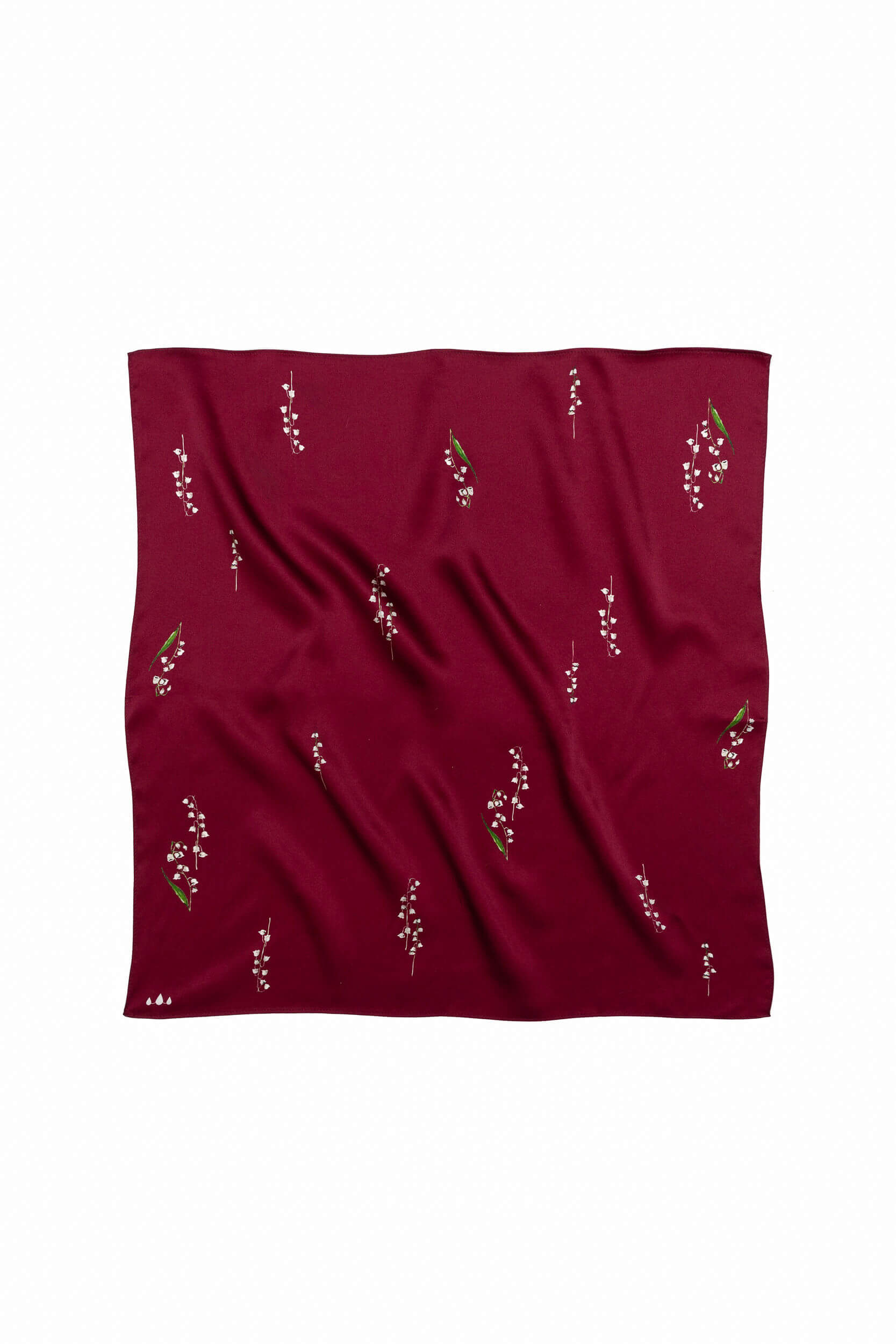 Red fabric with small floral patterns on a white background