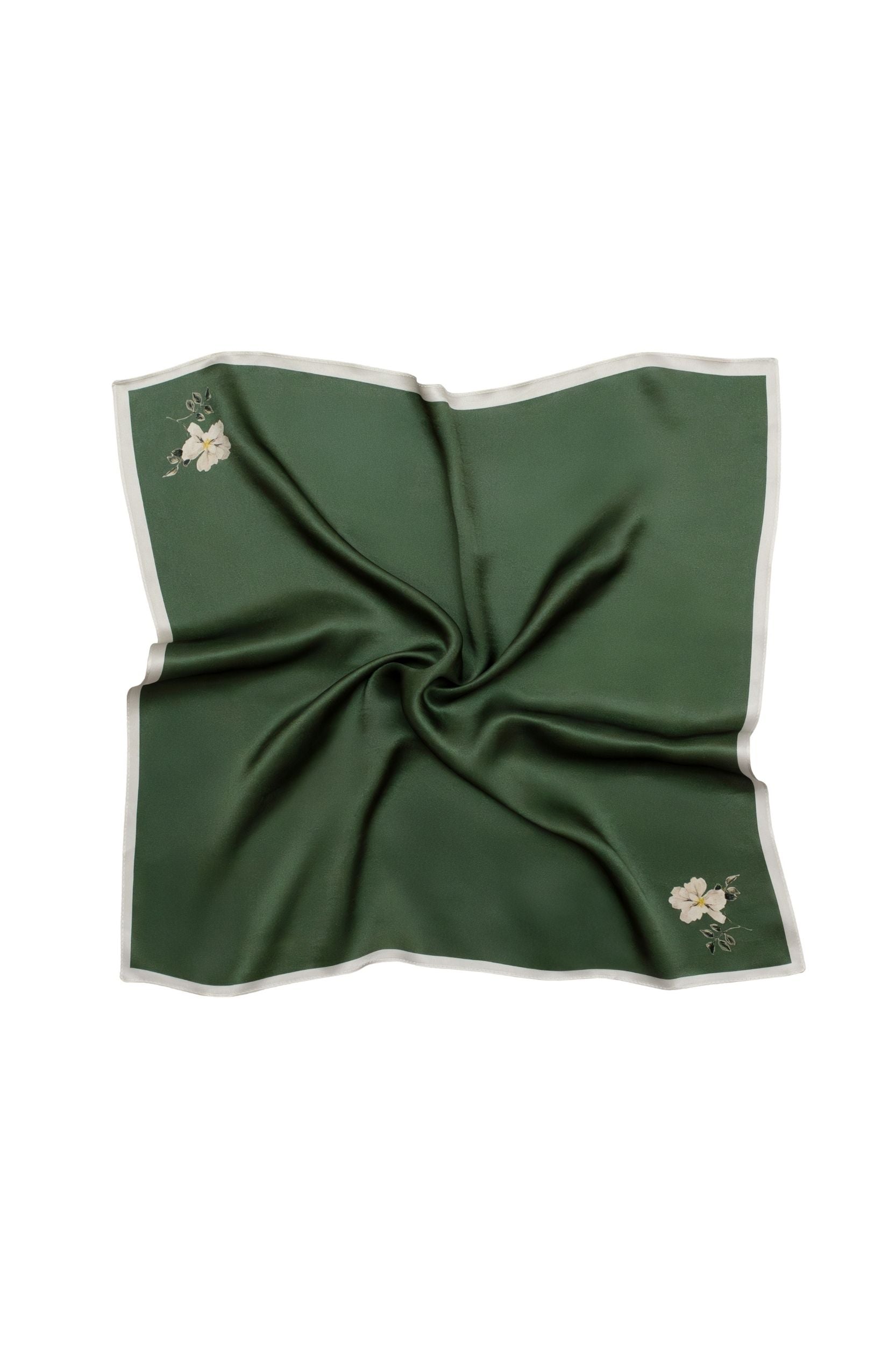 Green square scarf with floral print on a white background