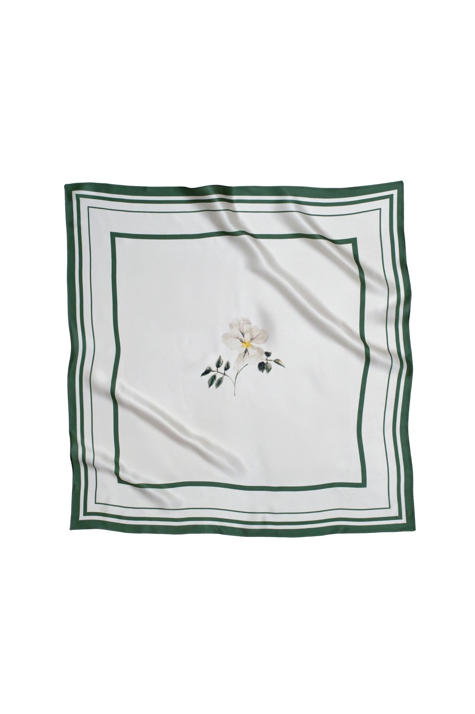White square scarf with floral print and green border on a white background
