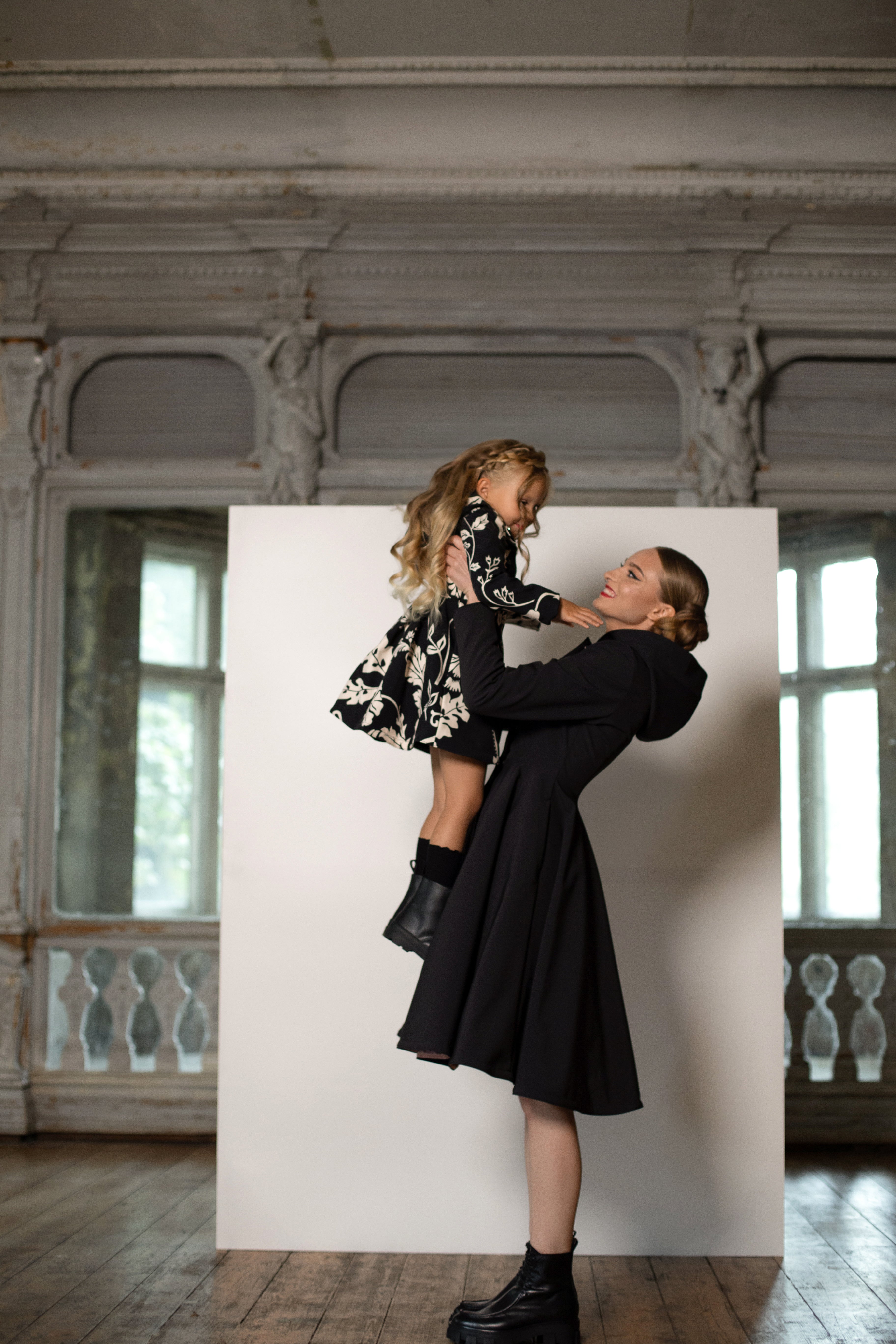 mommy and me set with black and white floral coat for girl and solid black women's coat