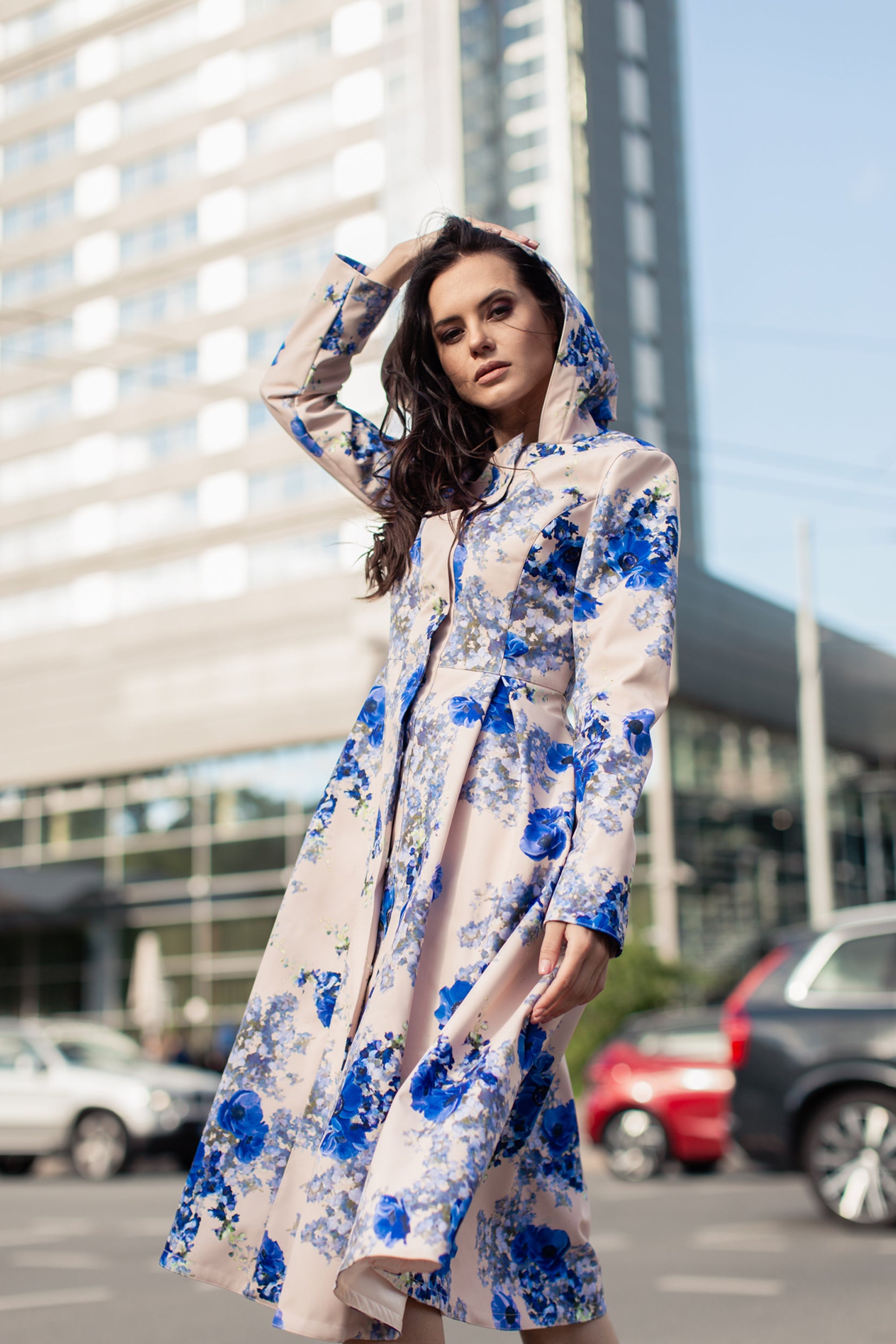 Front view of Cornflower Blue coat by RainSisters – beige women’s coat with blue floral print and elegant flared skirt