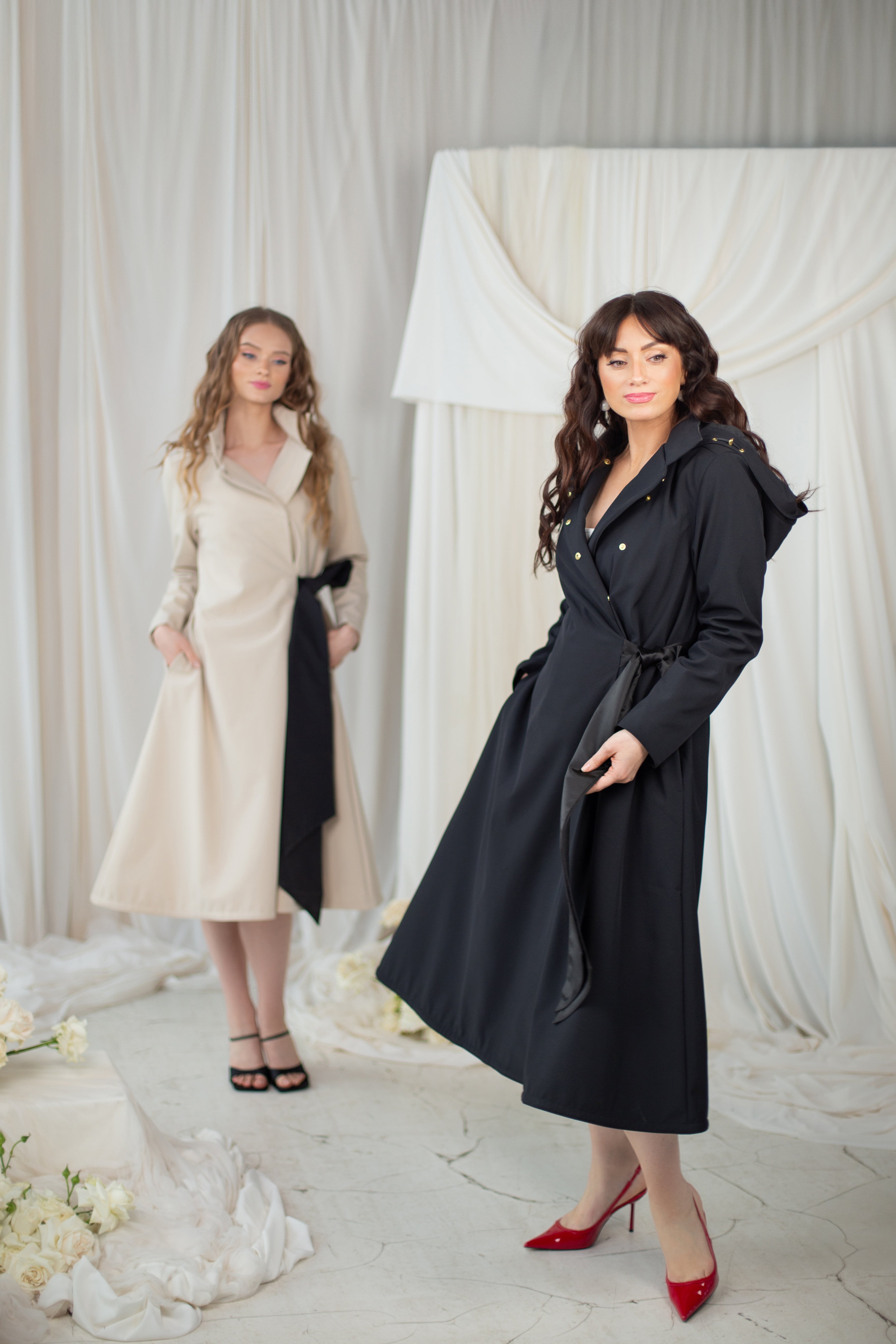 Beige and black coats with bow
