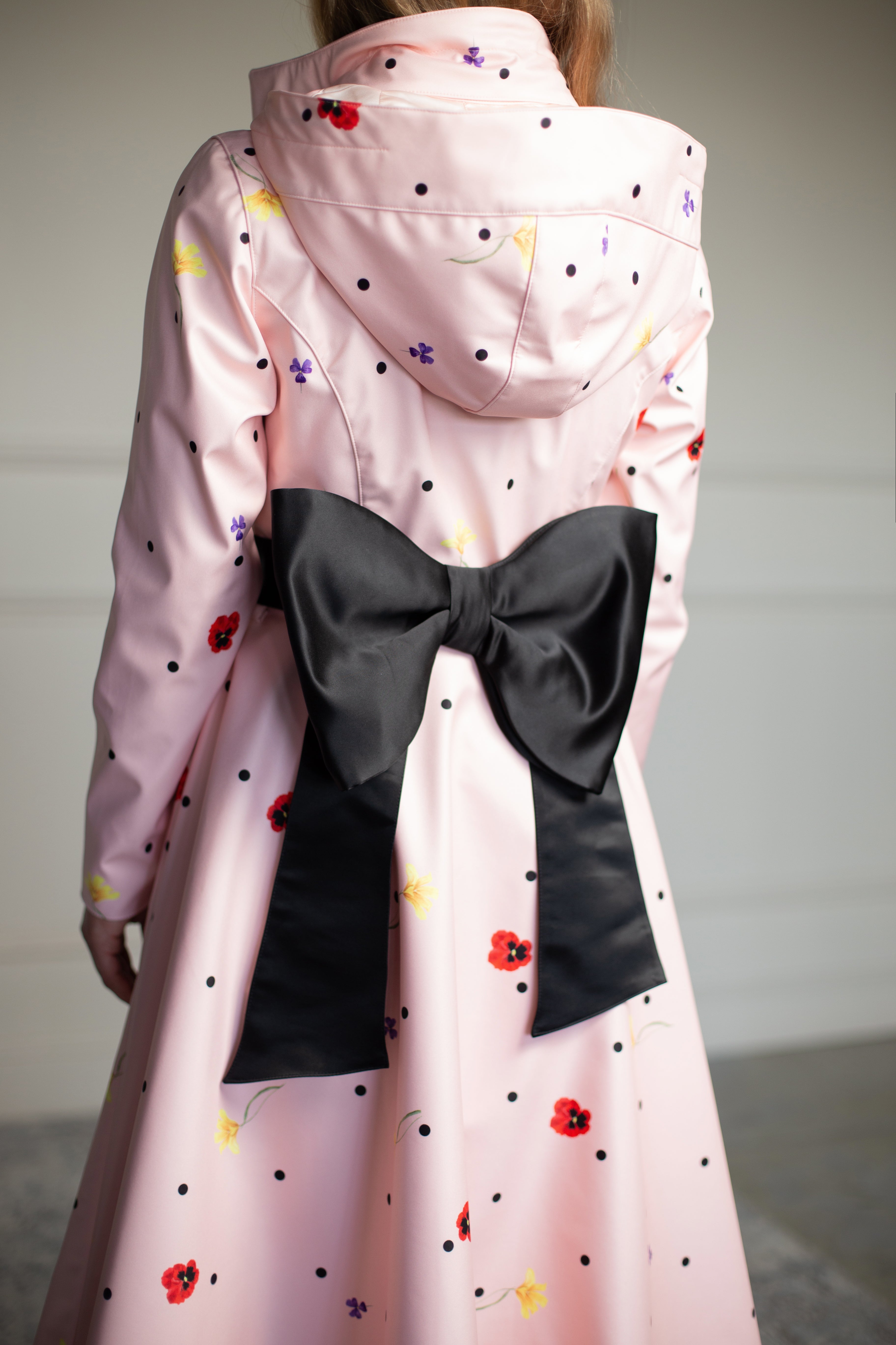 Pink Coat with polka dots and black bow belt