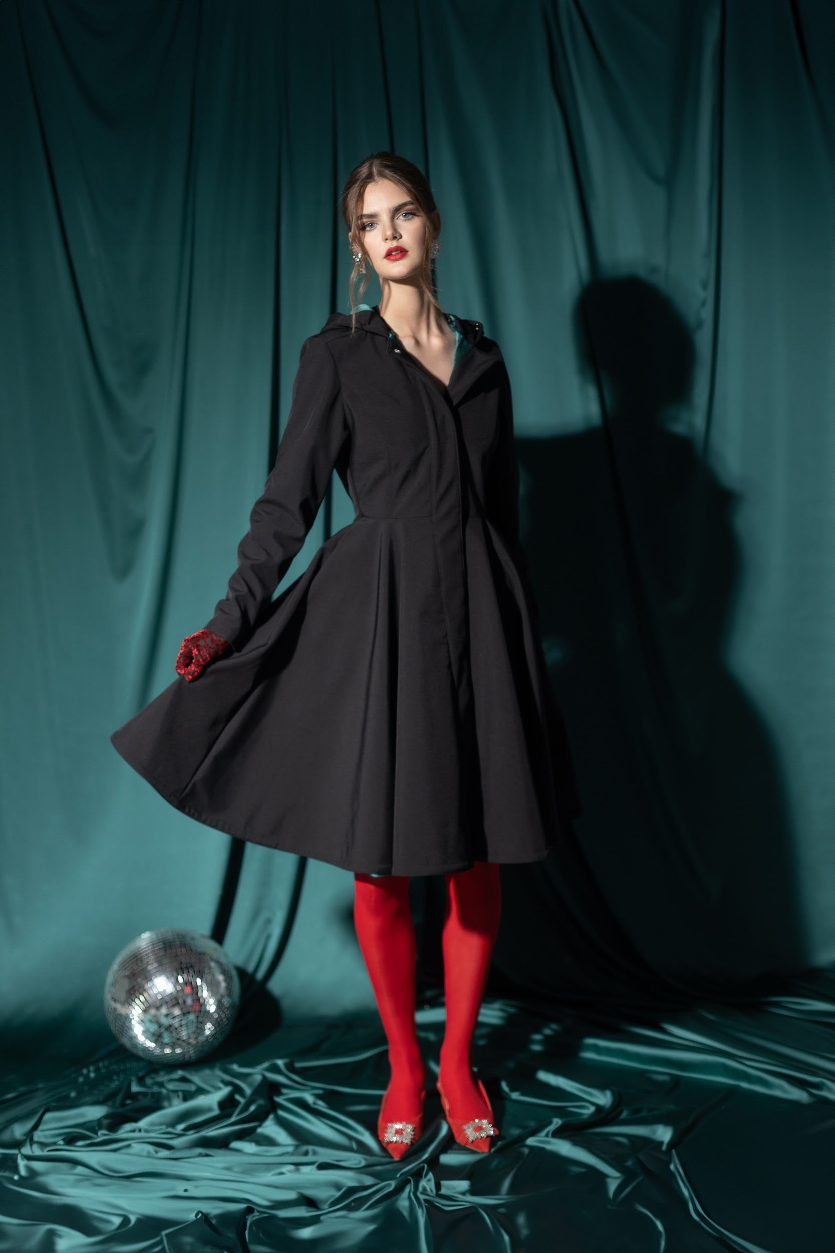 fitted and flared Solid Black Coat with emerald green lining