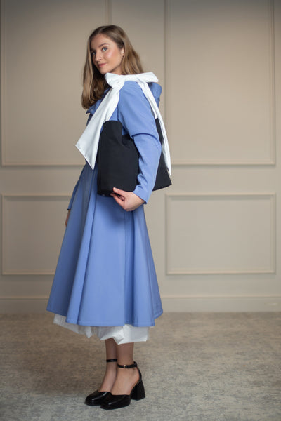 Chic black bow tote bag, perfectly paired with the Blue Breeze coat; adds sophistication and structure to any outfit.