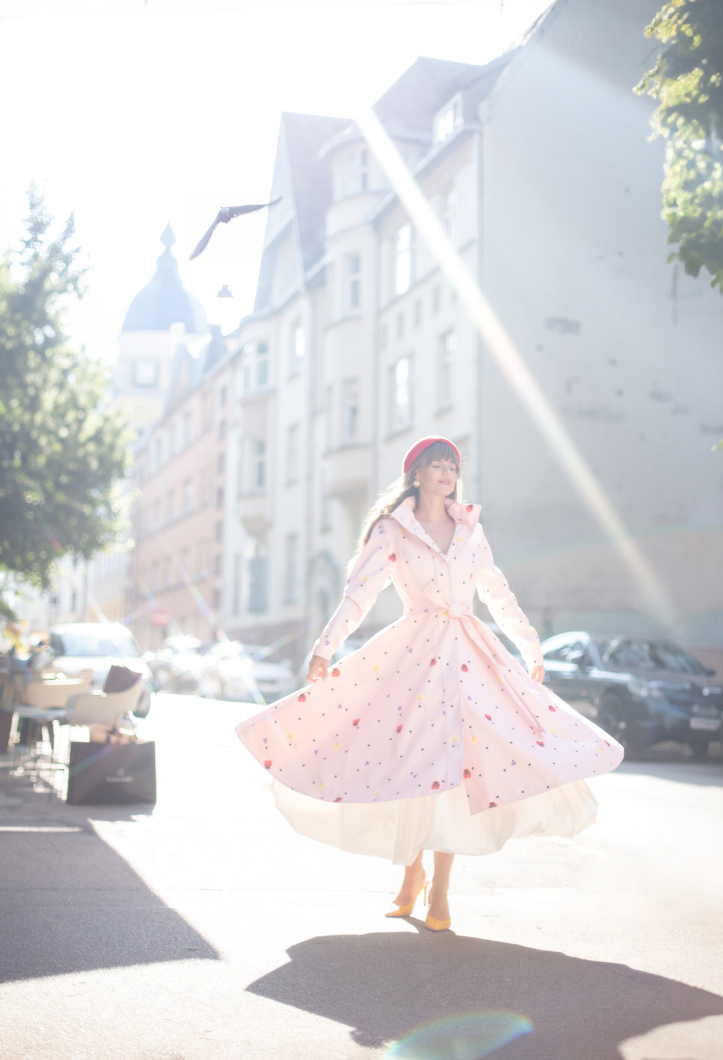 flared pink coat with flower print and polka dots