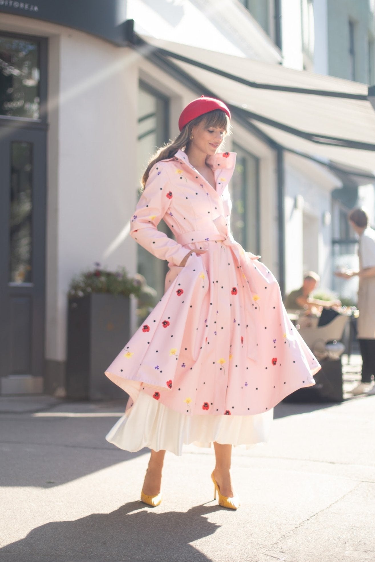 light pink coat with tie belt