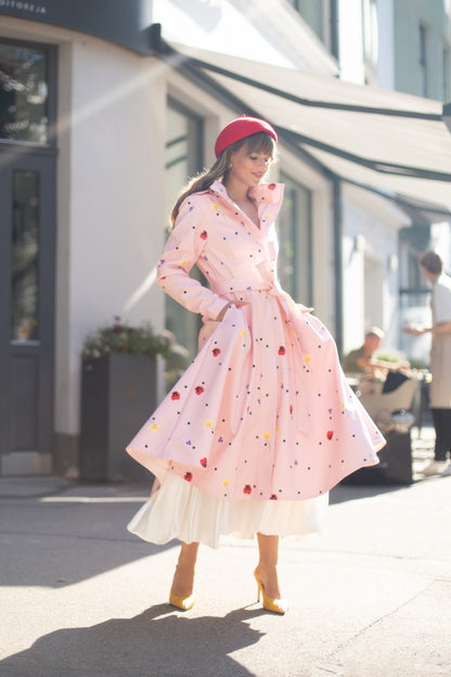 light pink coat with tie belt