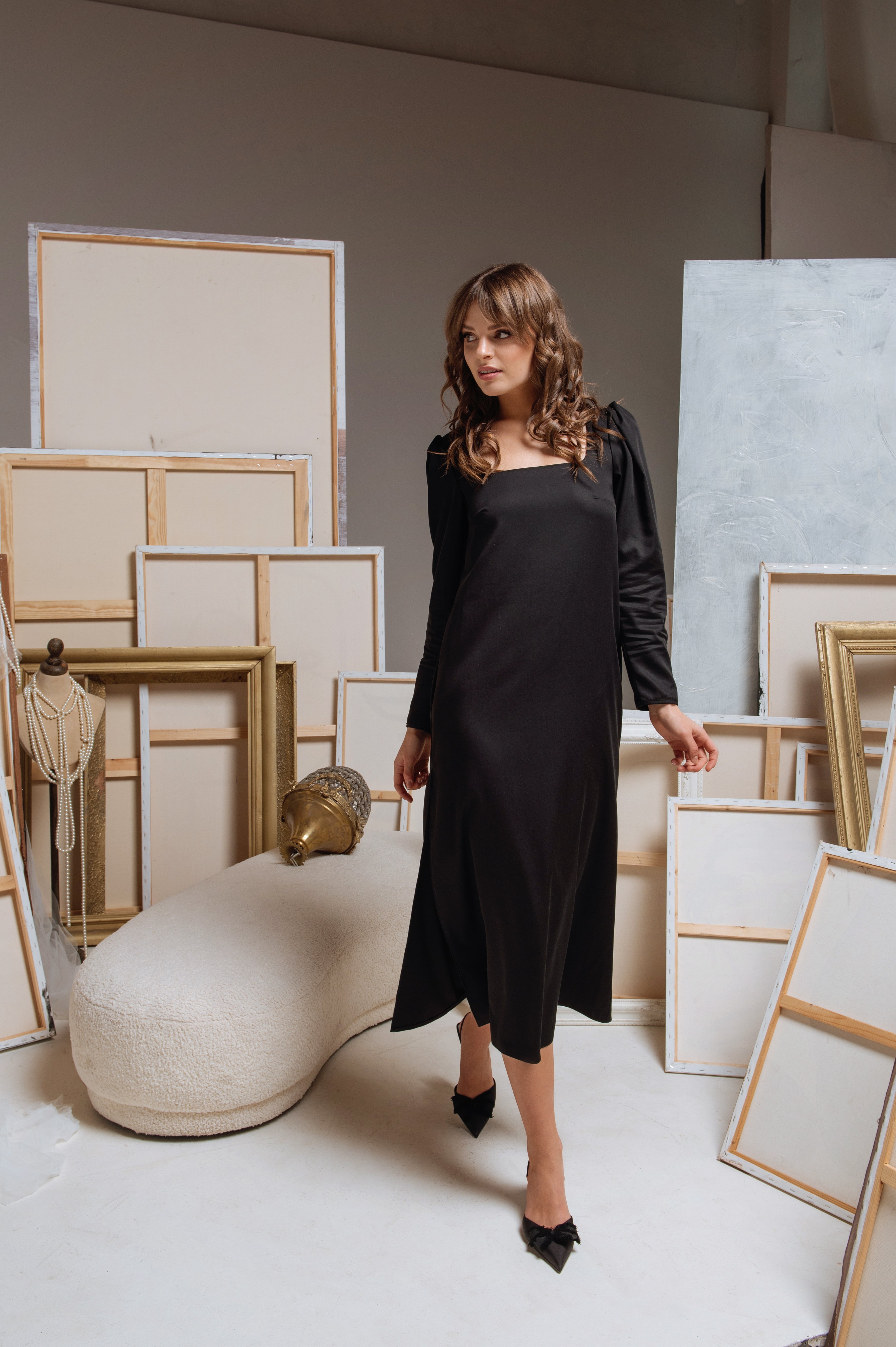 Model walking, showing the graceful movement of the dress without the belt. 