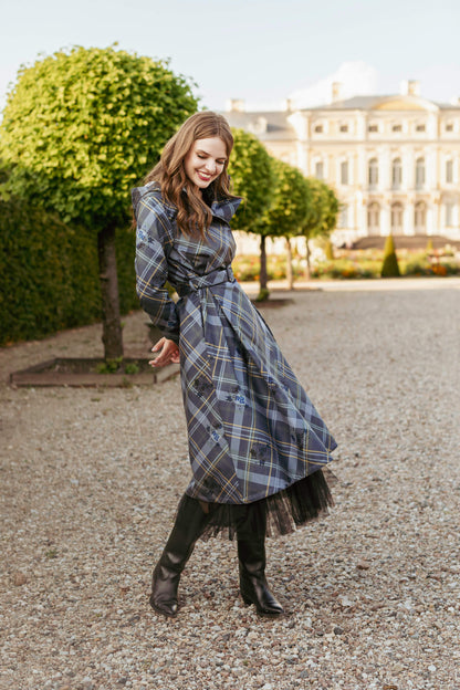 Turning gracefully in Duchess in Blue coat, showing pleated skirt movement.