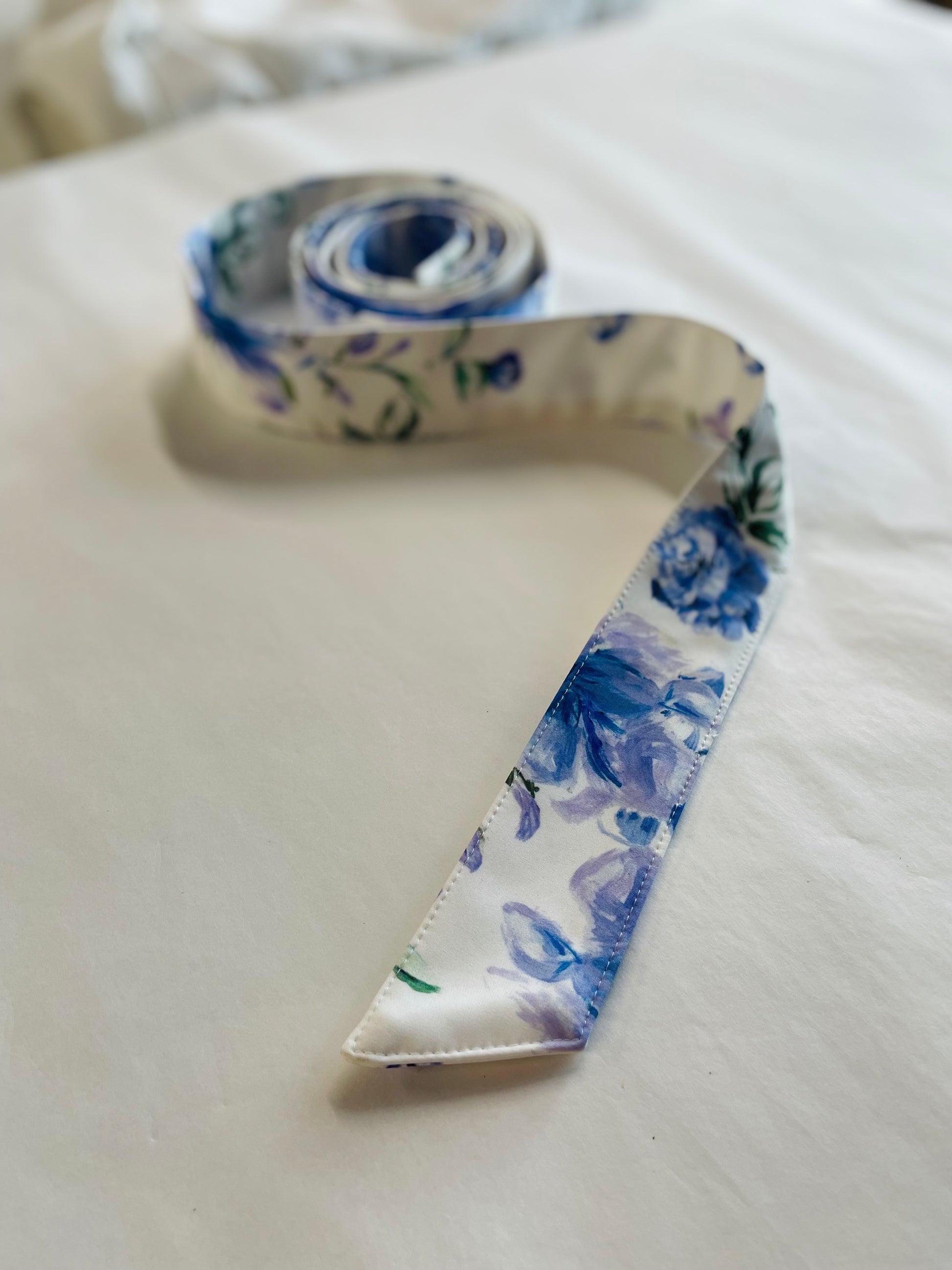 White belt with blue flower print
