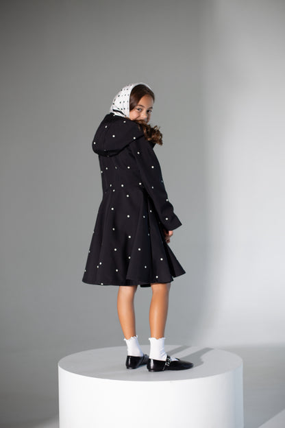 Girls' timeless polka dots coat with classic black and white pattern