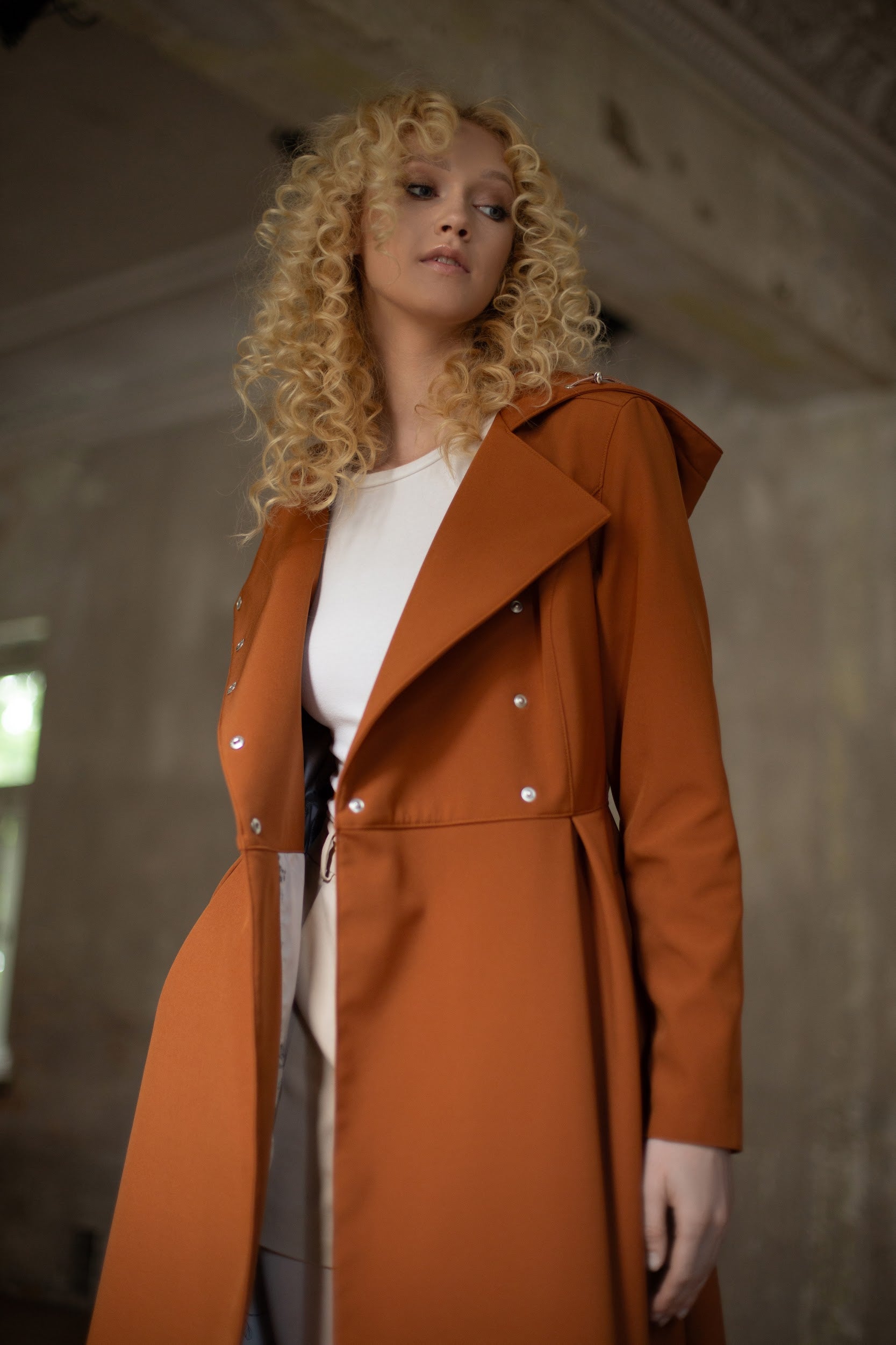 double breasted coat in caramel brown and pleated skirts