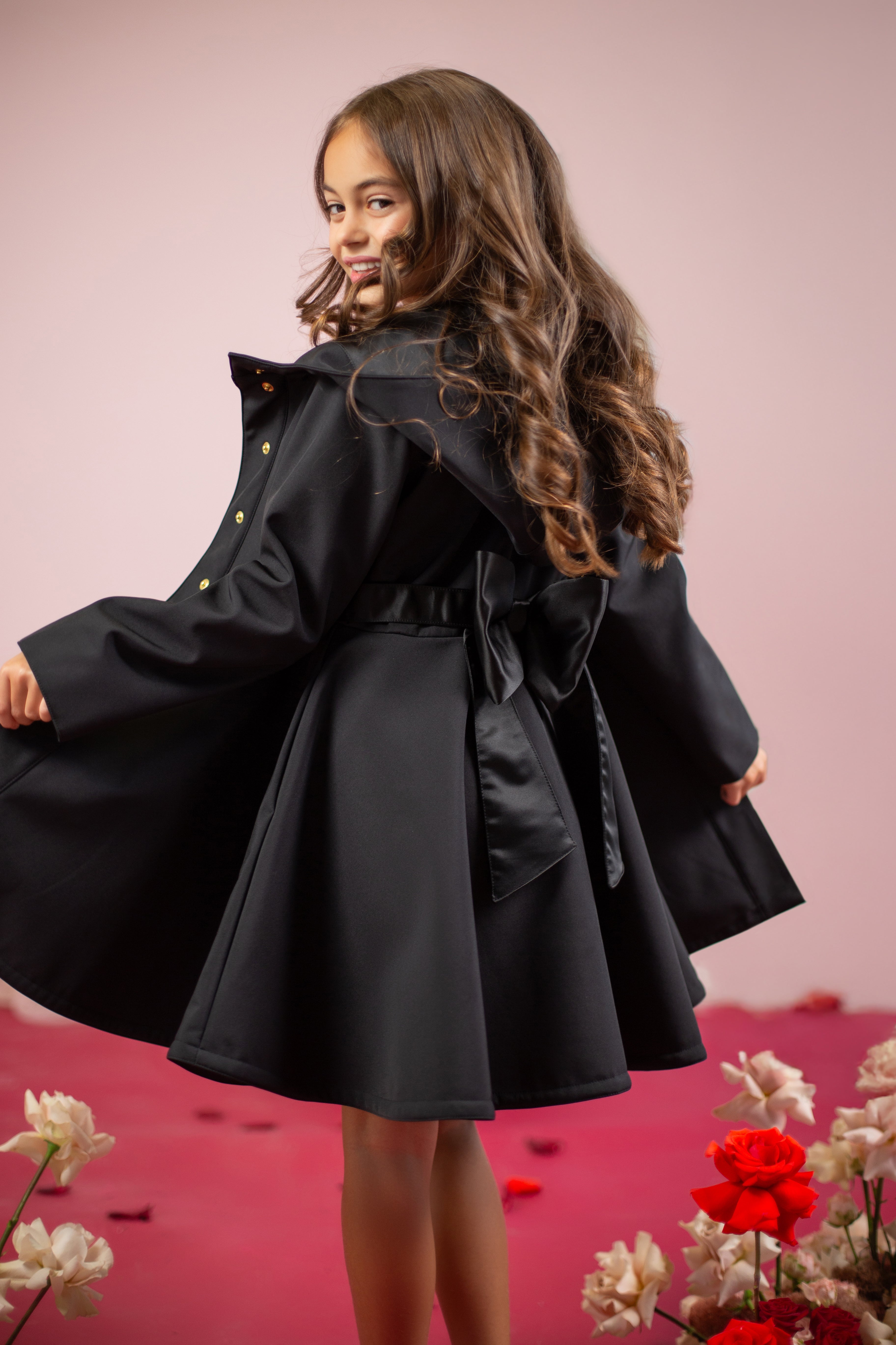 Black girls coat with a bow on the back