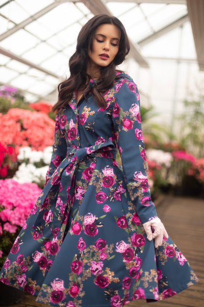Flared water-resistant coat in denim blue colour and pink flower print