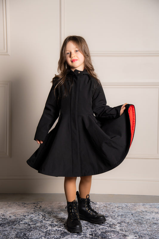black girls coat with bright red lining
