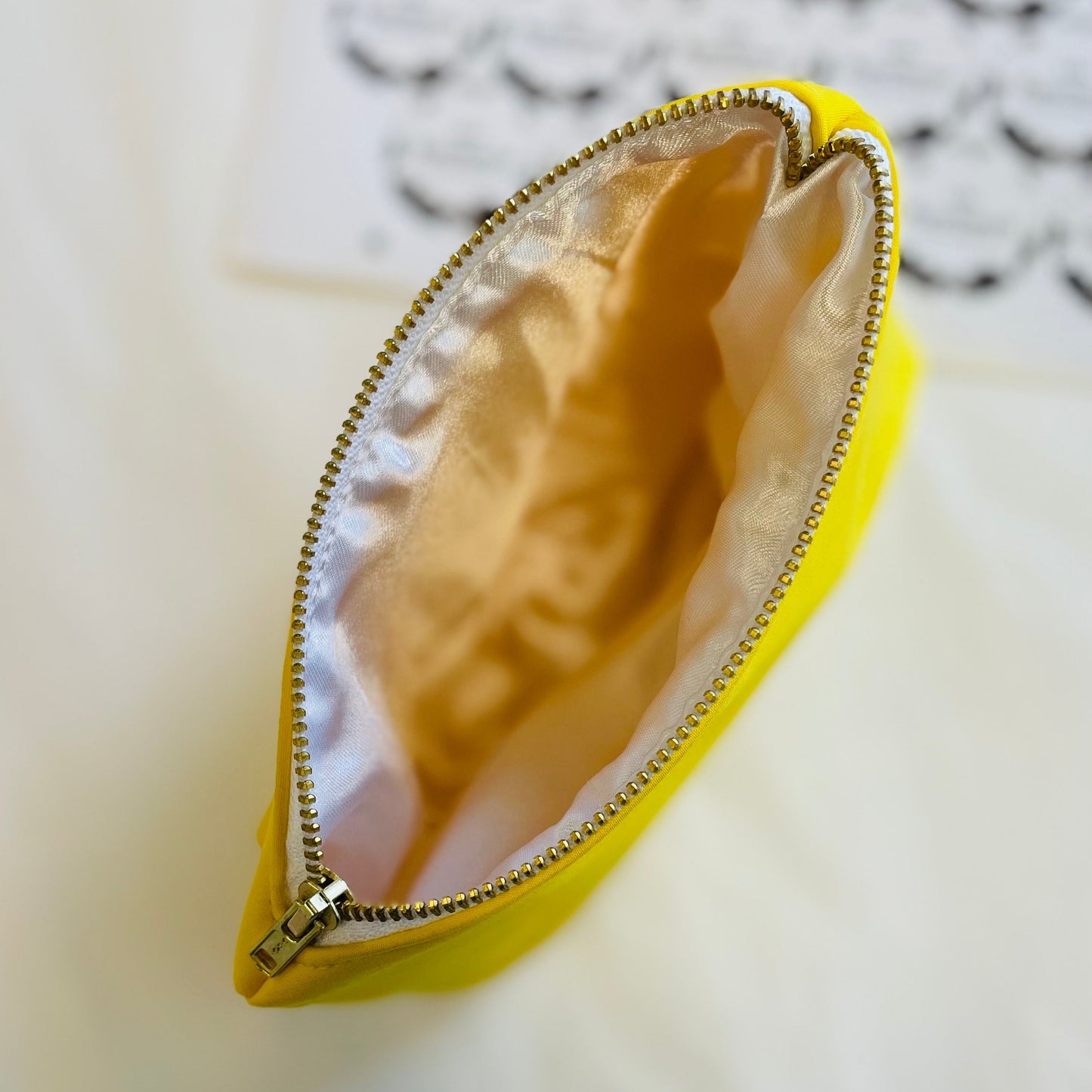 solid yellow makeup bag with light lining
