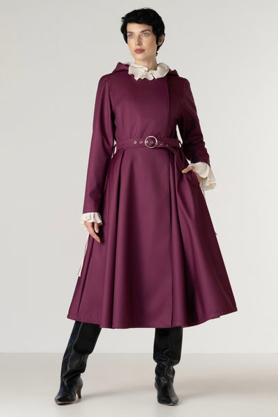 Women's deep burgundy double-breasted trench coat in a rich berry tone with a matching buckle belt, front full-length view.